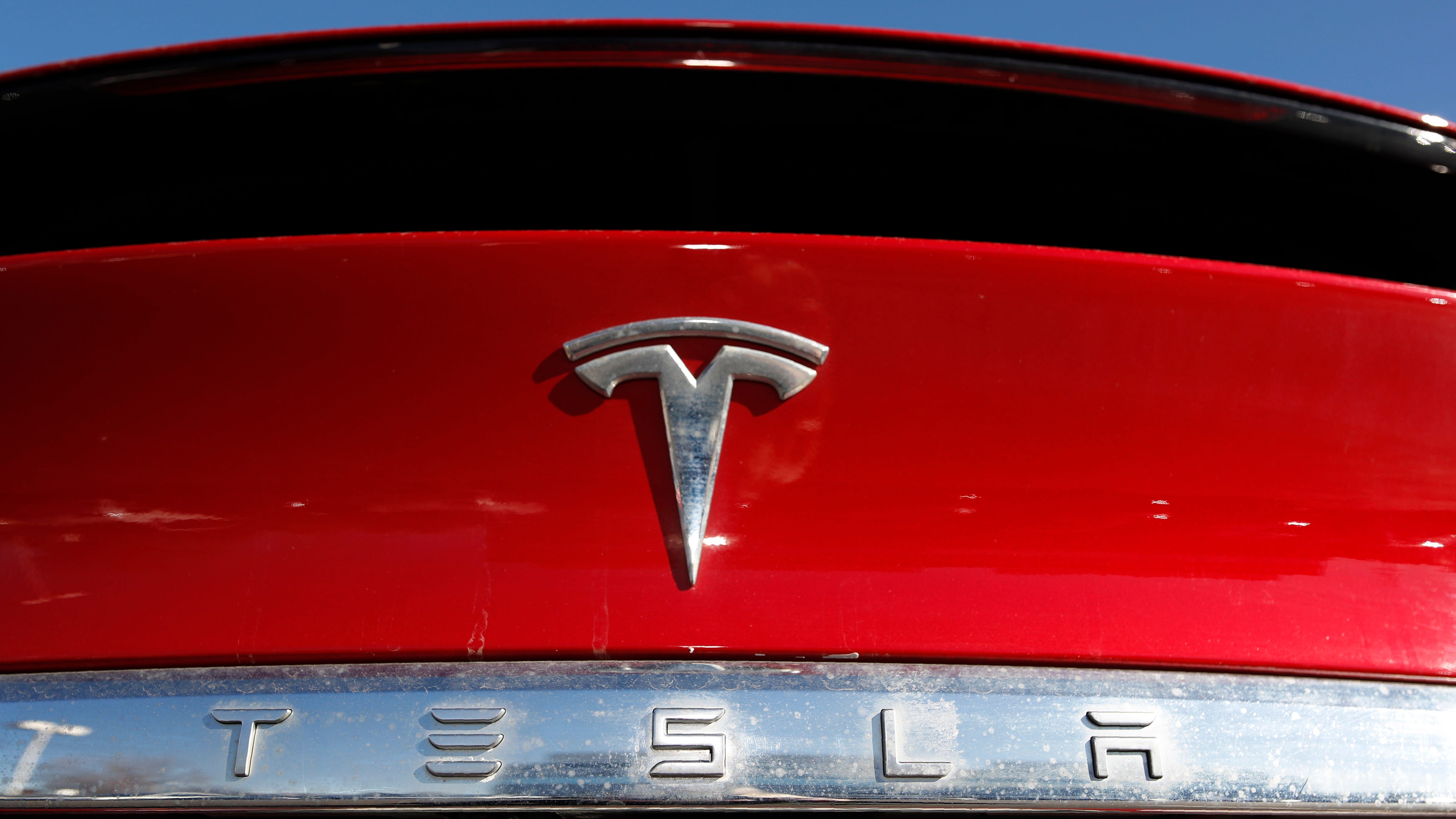 Tesla posts record profits as its deliveries soared in 2021