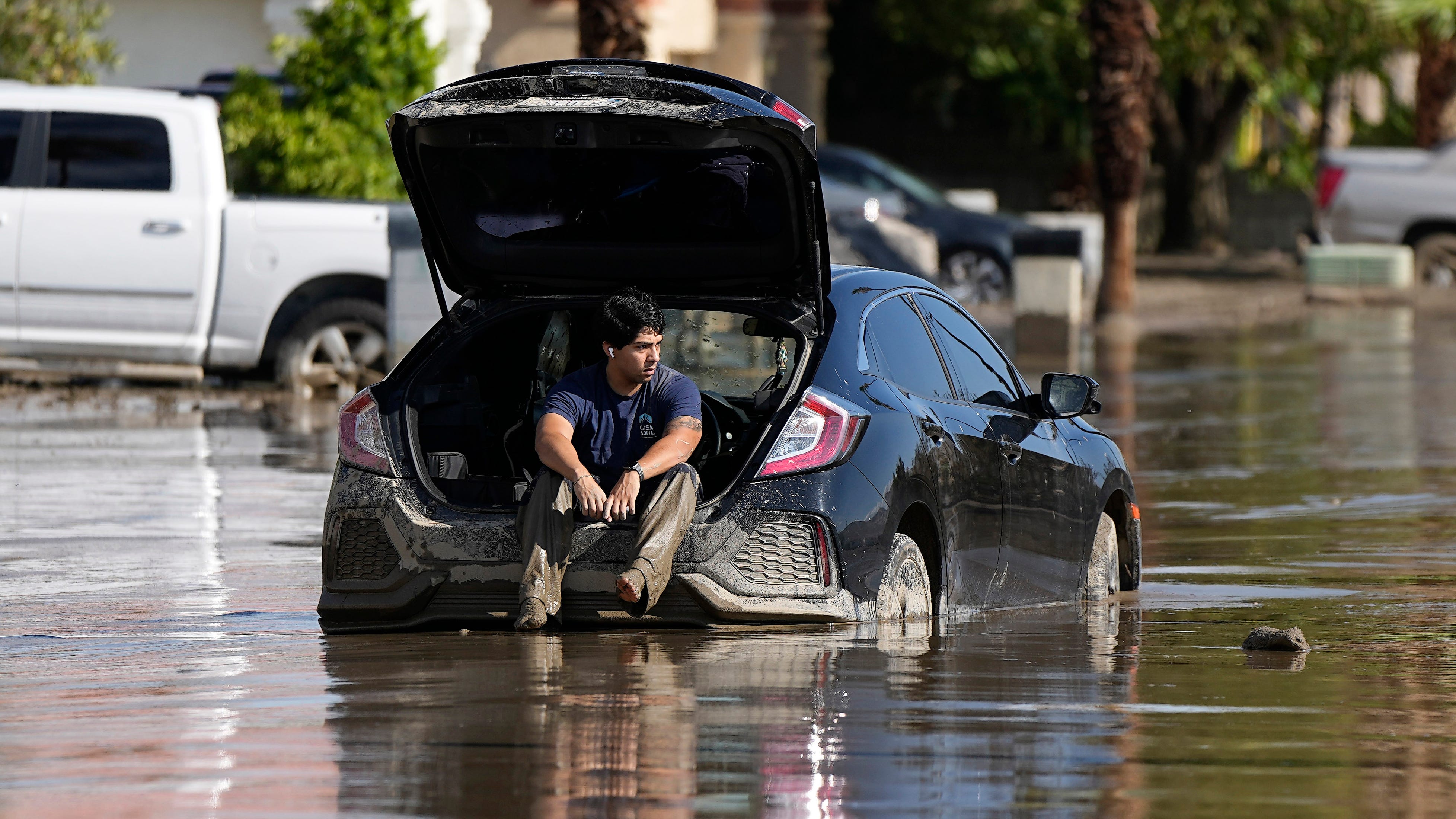 As Tropical Storm Hilary shrinks, desert and mountain towns dig themselves out of the mud