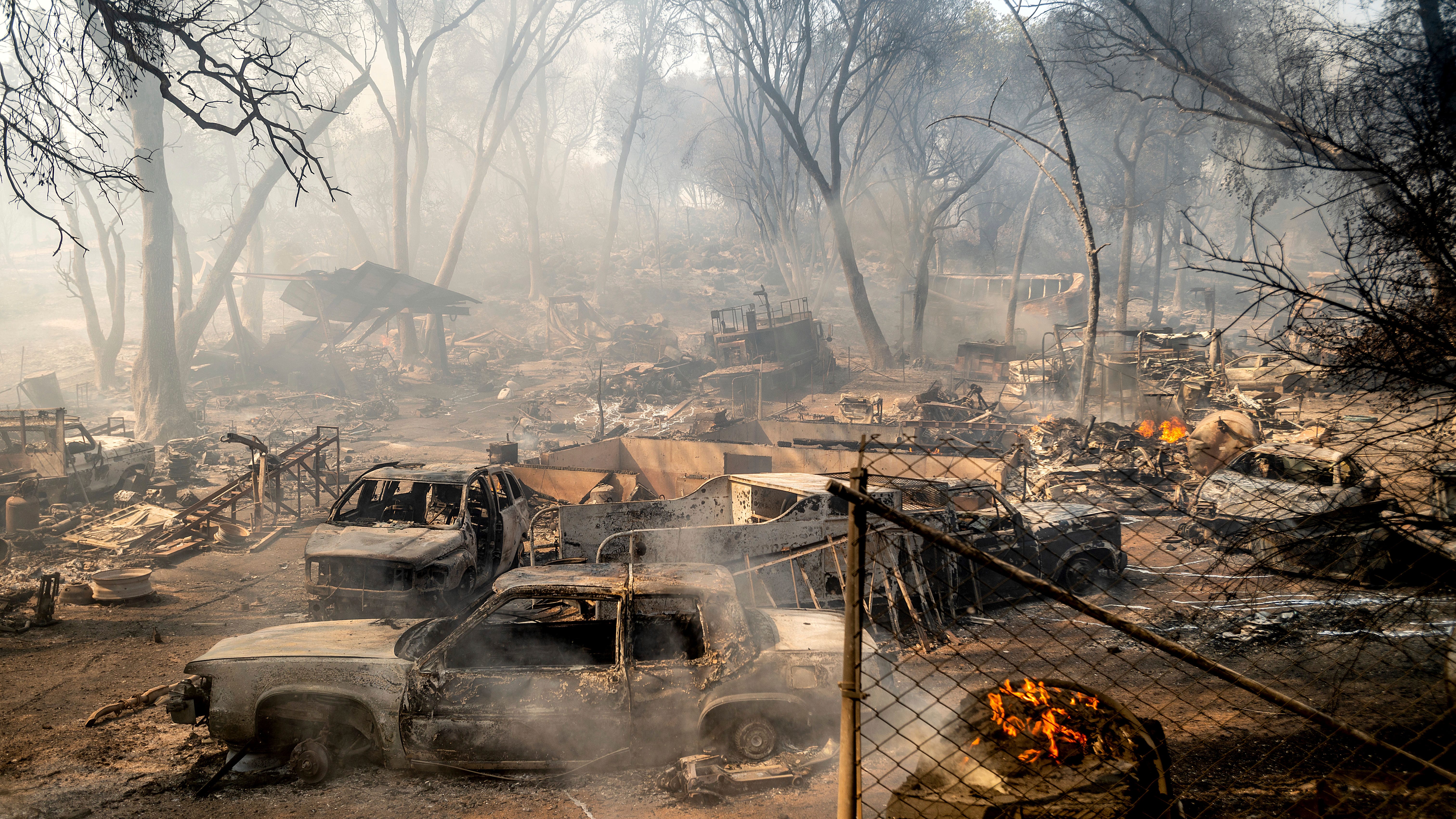 Dozens of homes burn as California wildfire siege continues