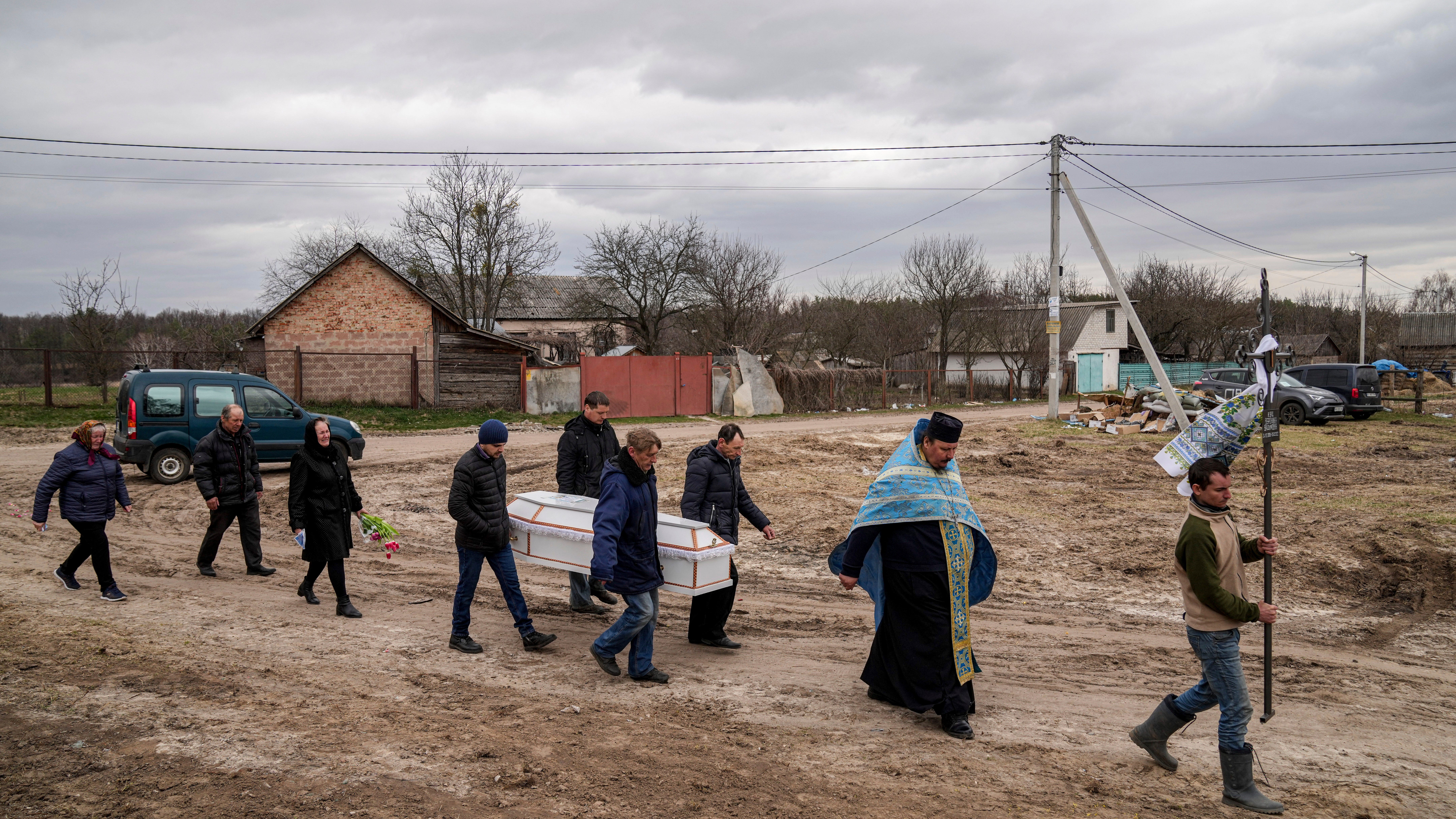 Ukrainian mom's pain at watching daughter's burial on phone
