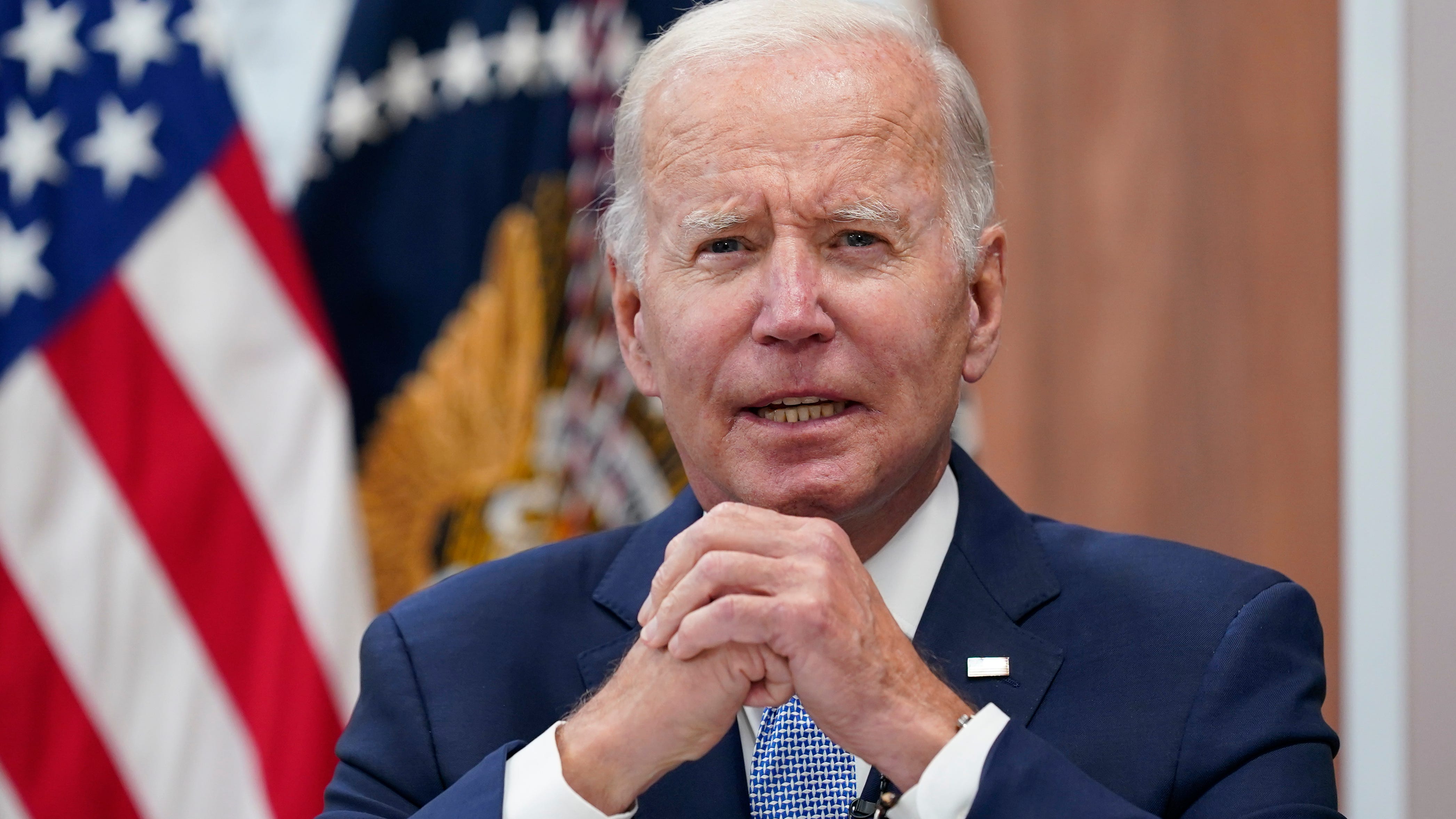 Biden's COVID sequel: back on the balcony, dog for company