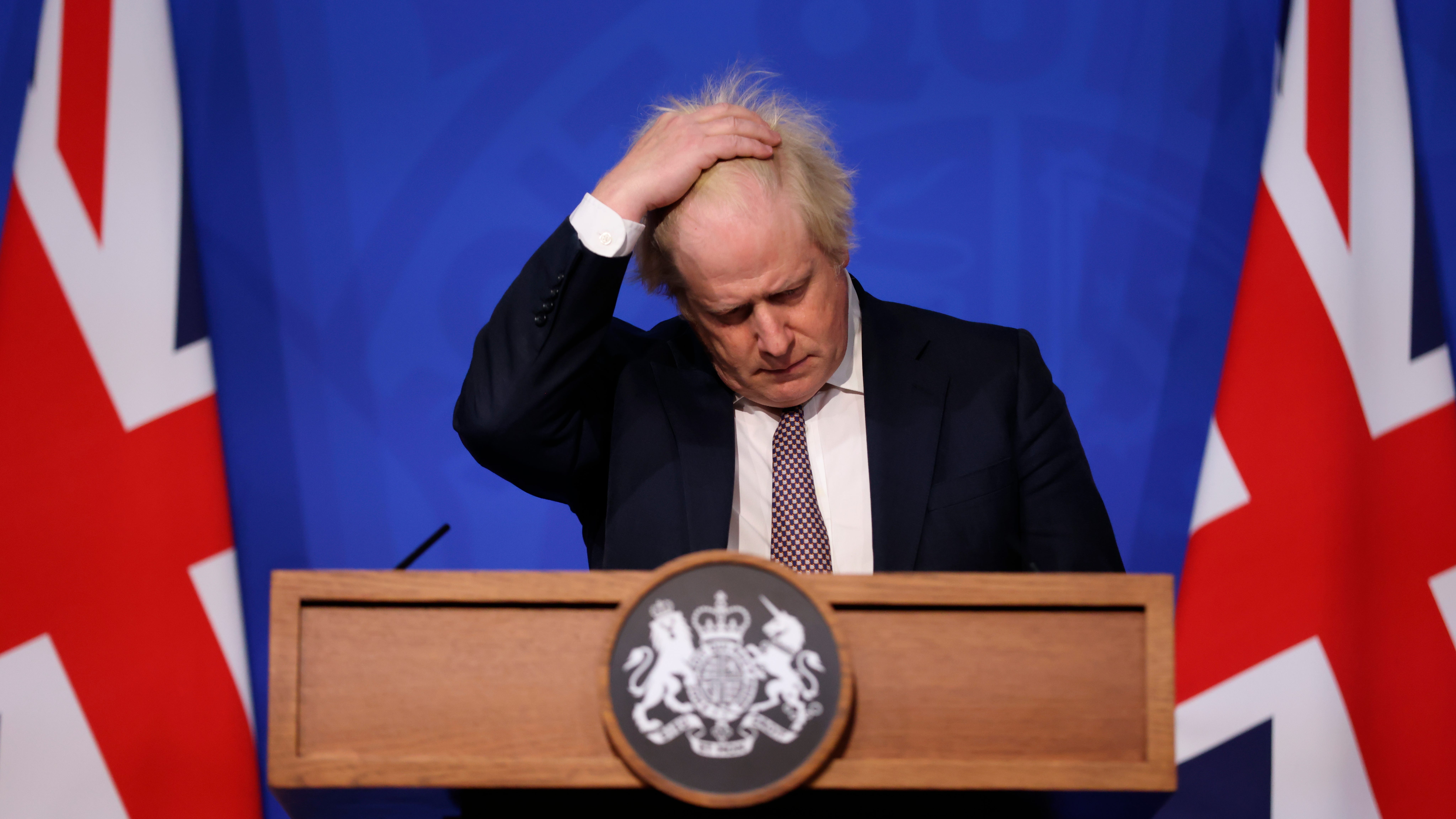 Britain tightens COVID rules as world on alert over omicron