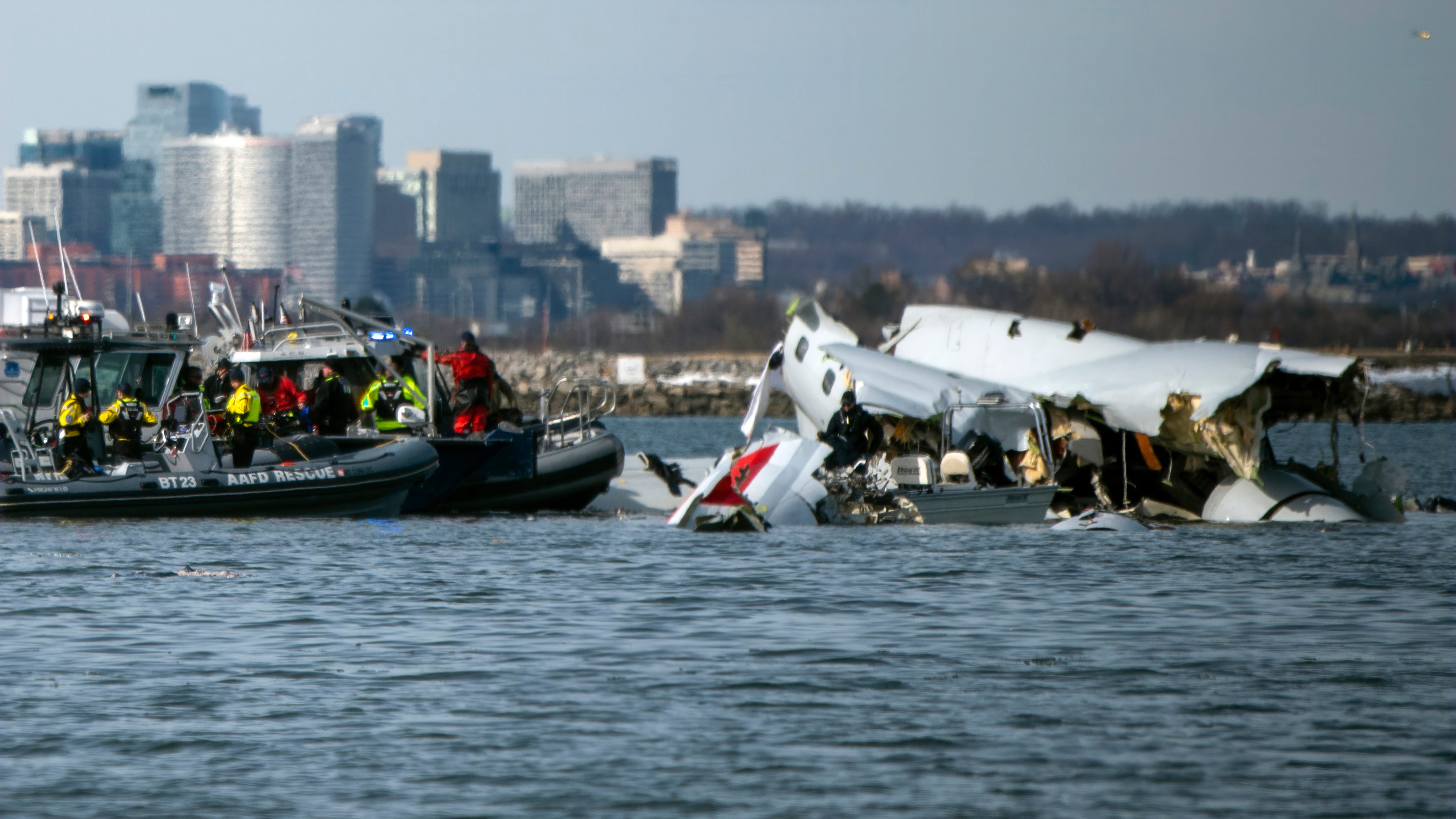 Boats return to the Potomac River for DC plane crash recovery and investigation