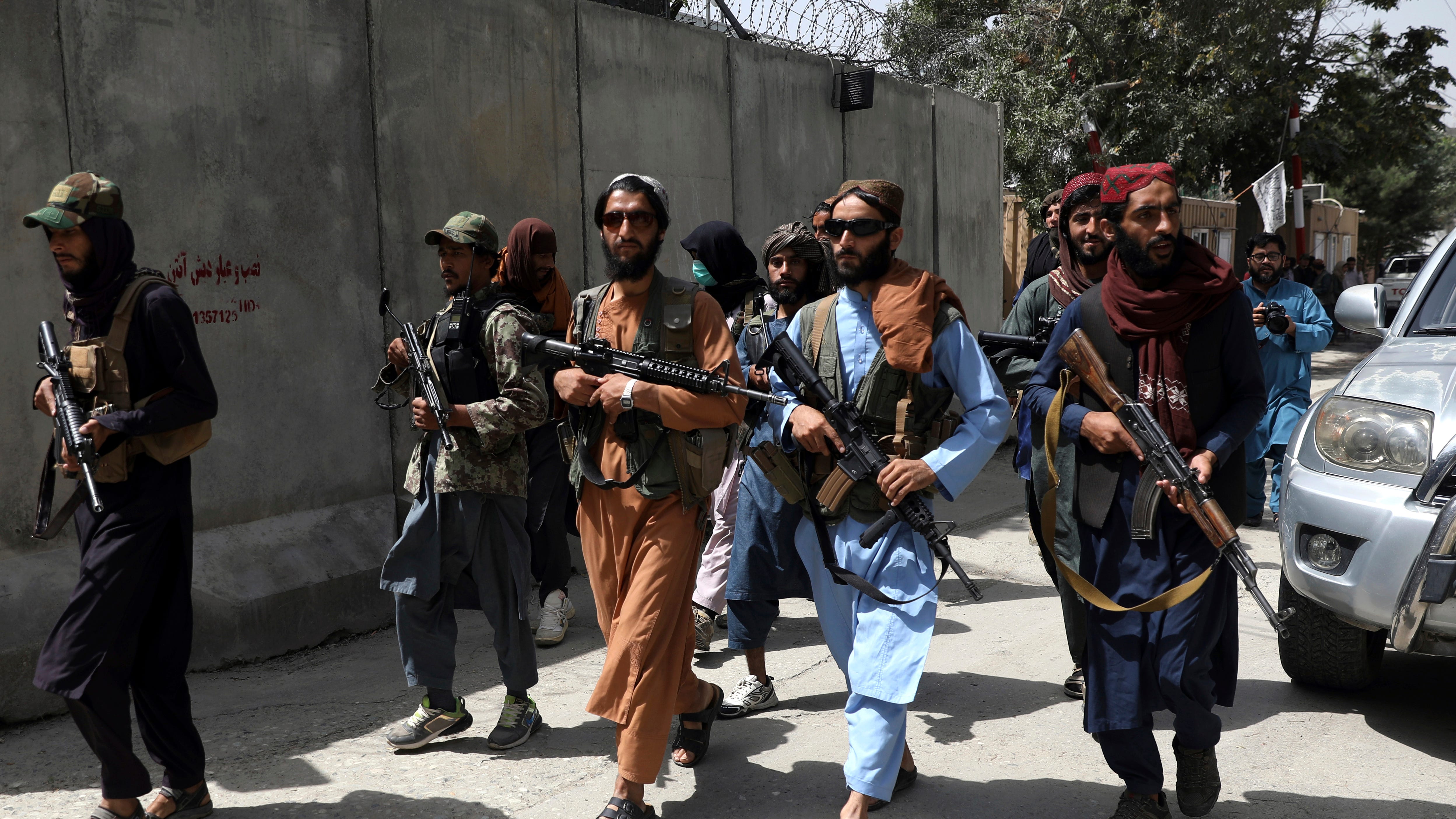 Taliban militants violently disperse rare Afghan protest