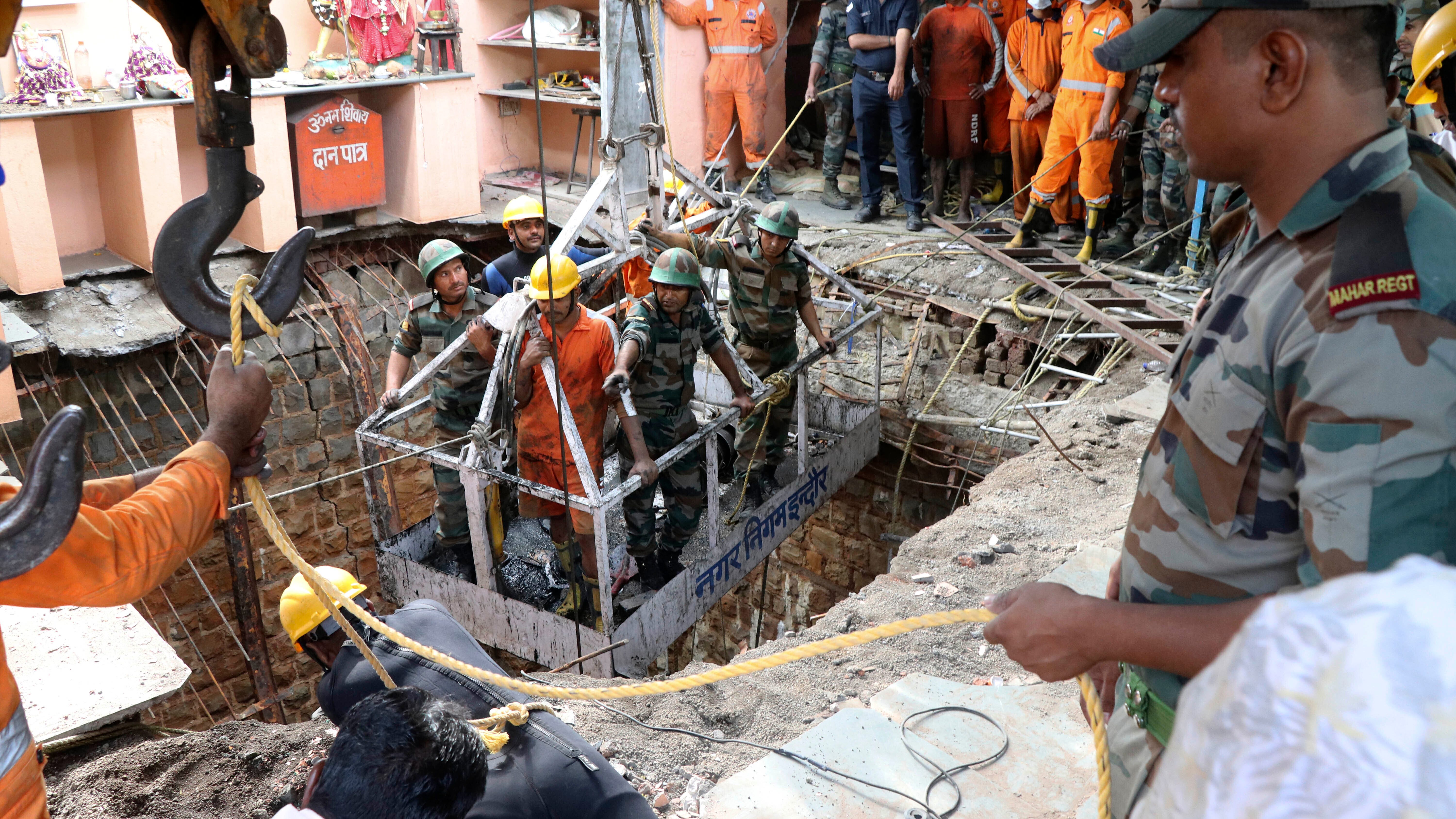 36 bodies found inside well after collapse at Indian temple