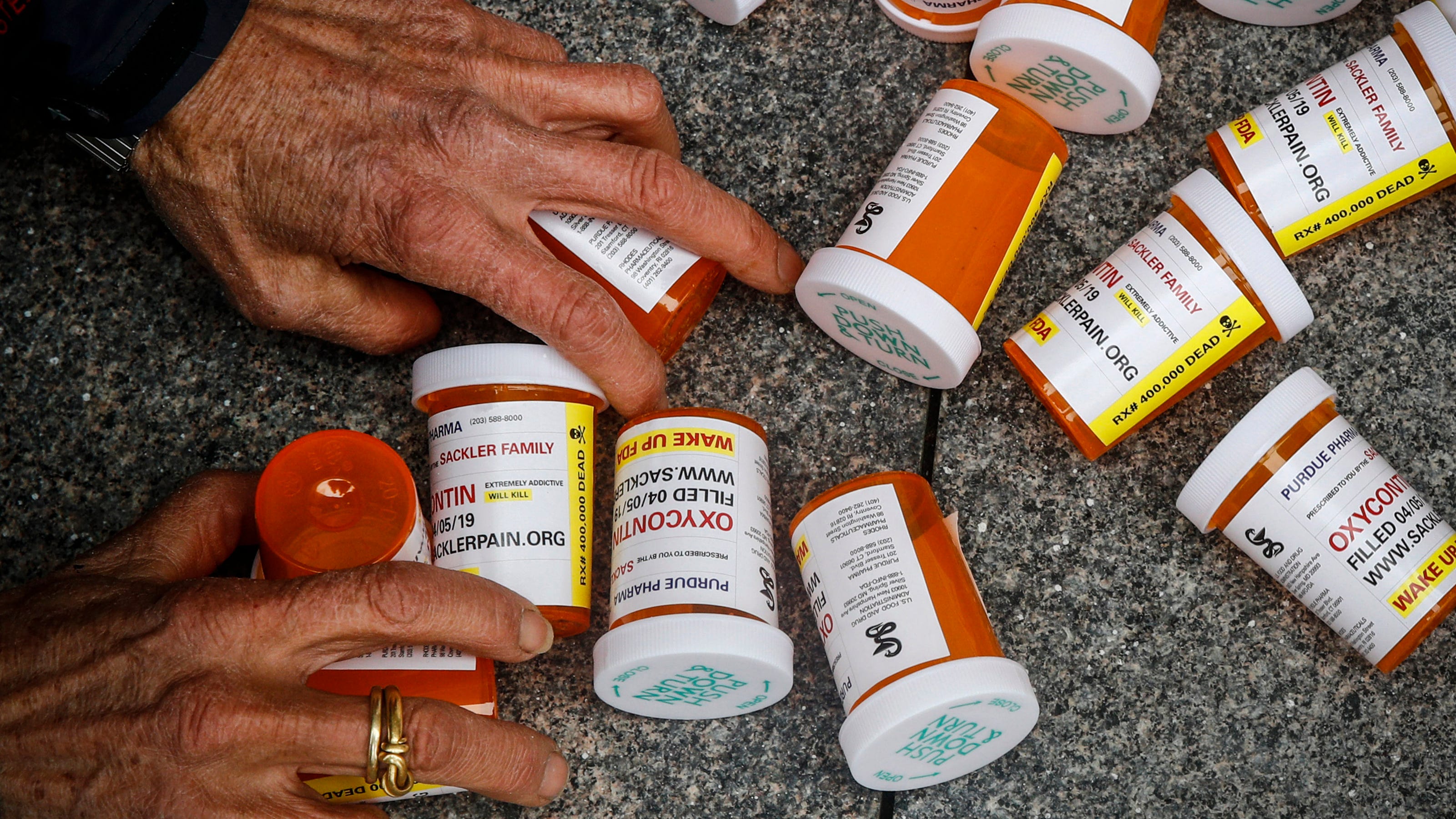 Suits against OxyContin owners on hold; negotiations ordered