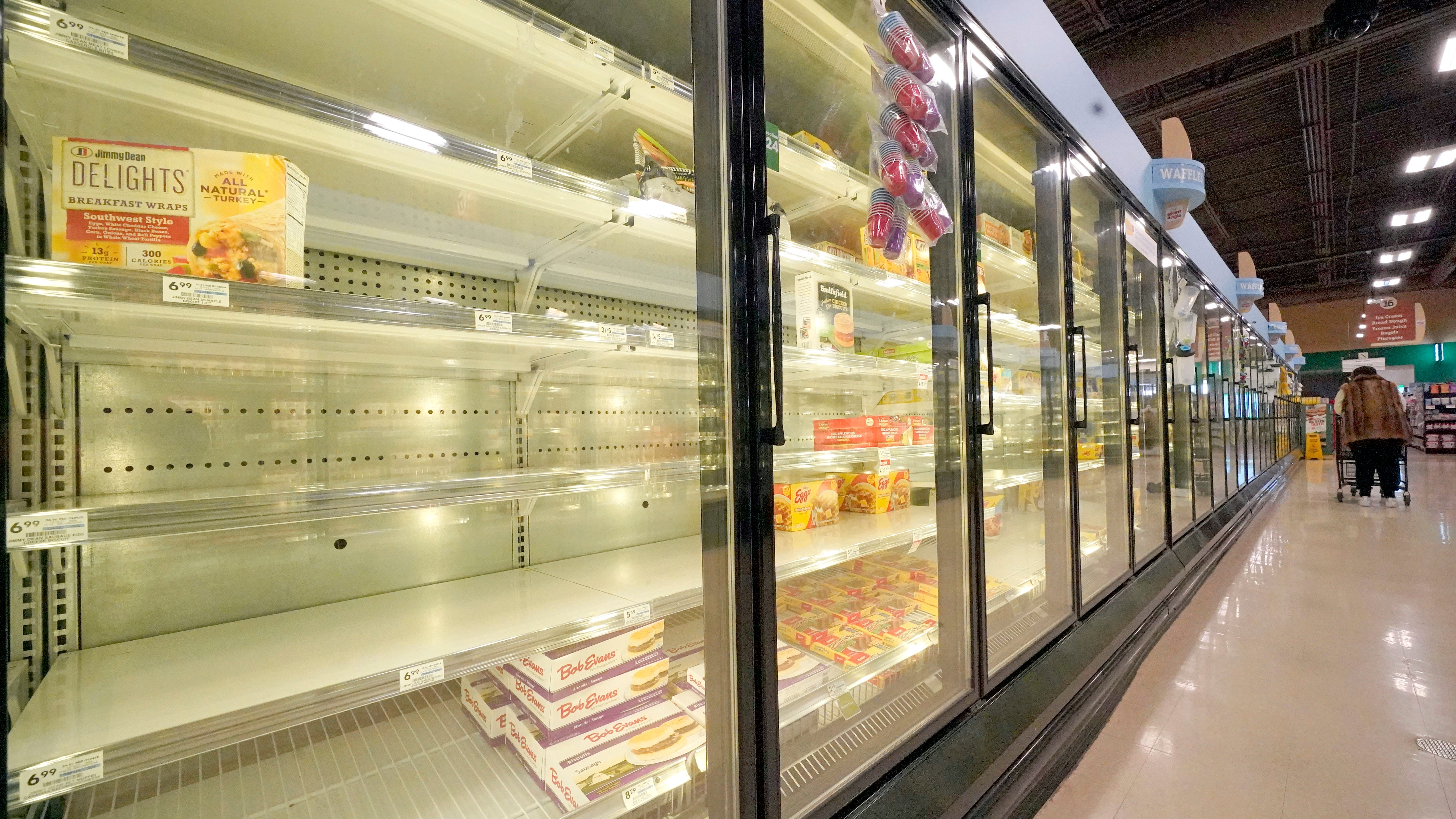 US shoppers find some groceries scarce due to virus, weather