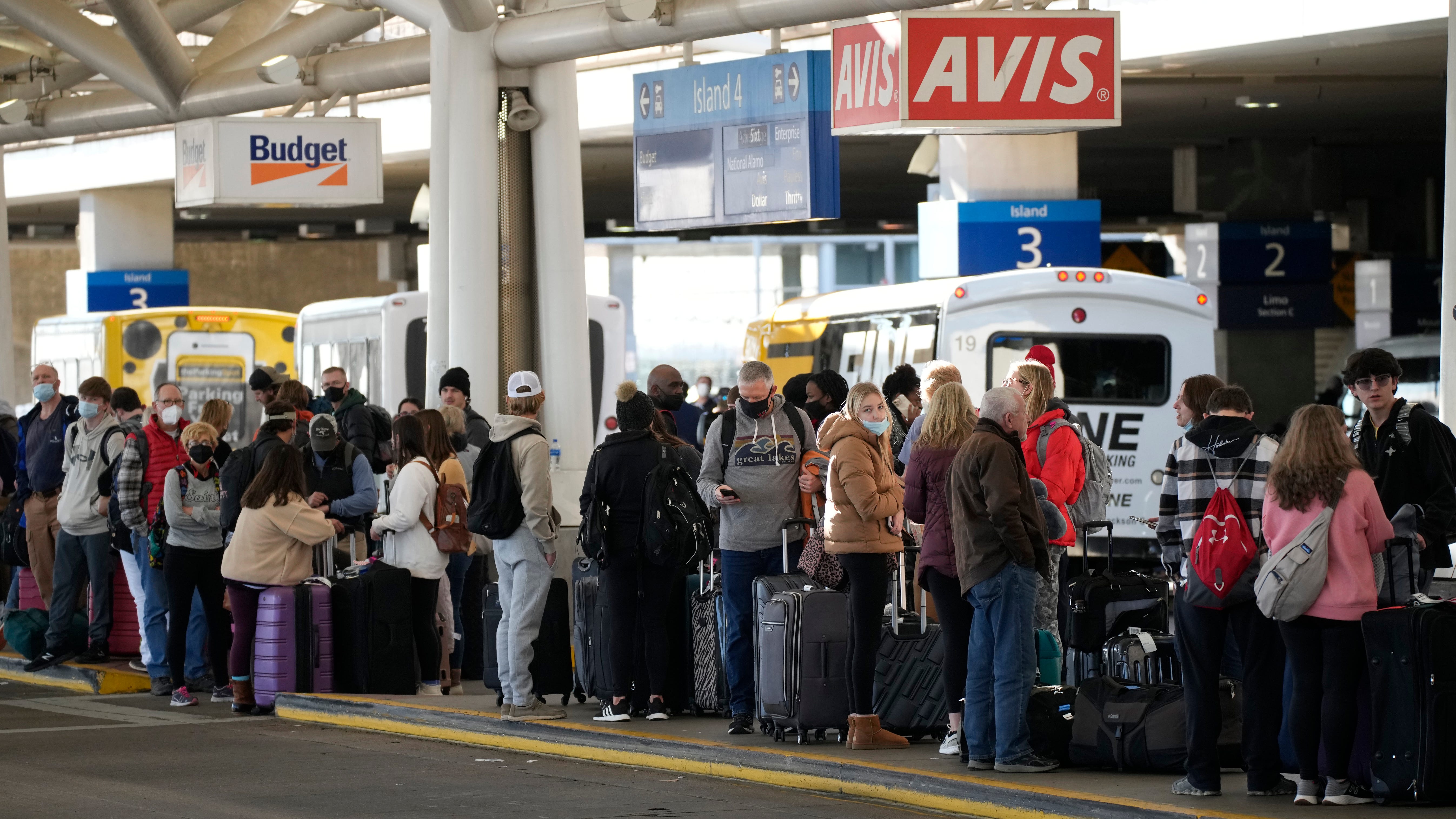 COVID-19 variant disrupts holiday travel but not shopping