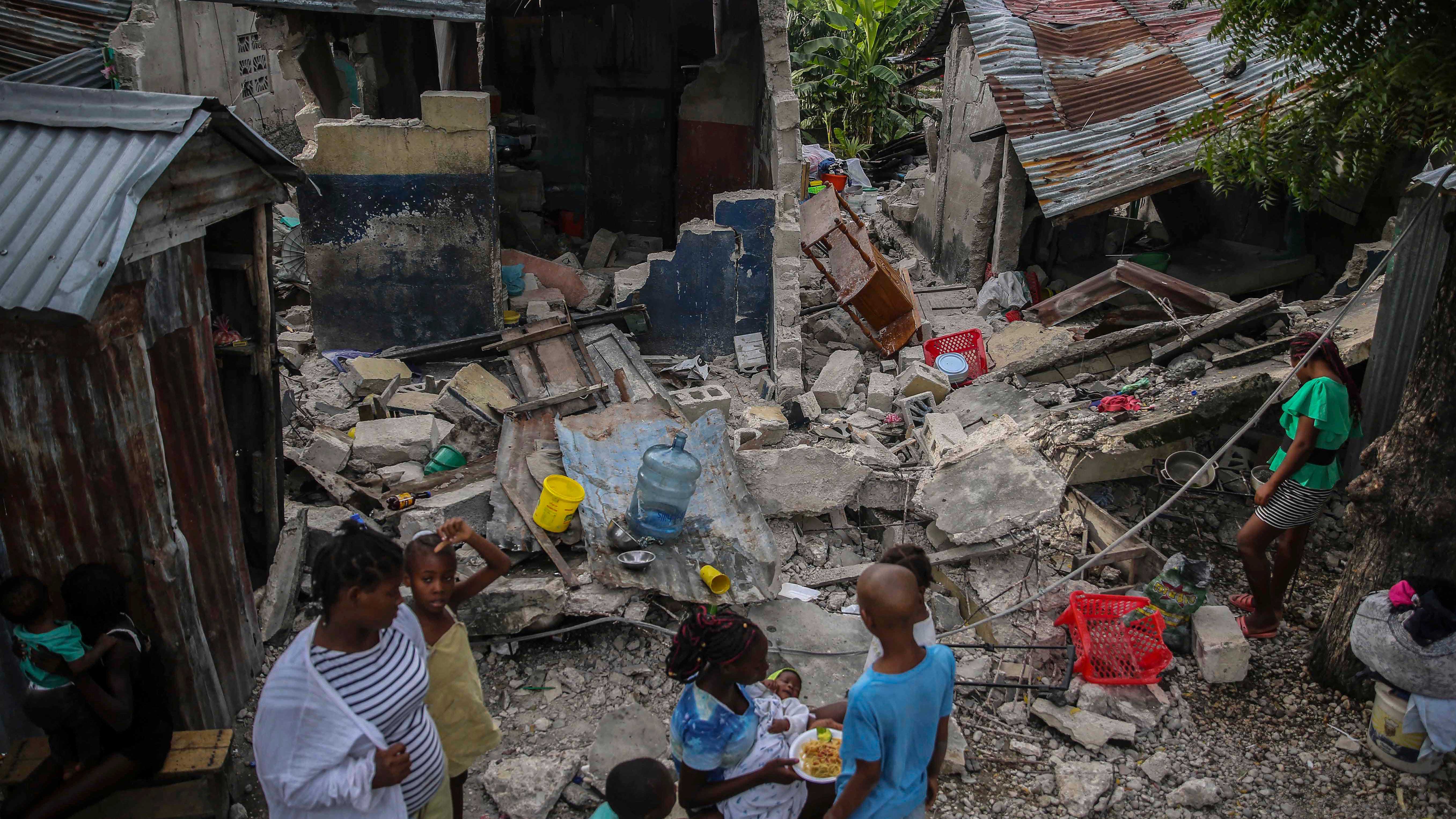 Rescuers racing in Haiti as storm threatens to follow quake