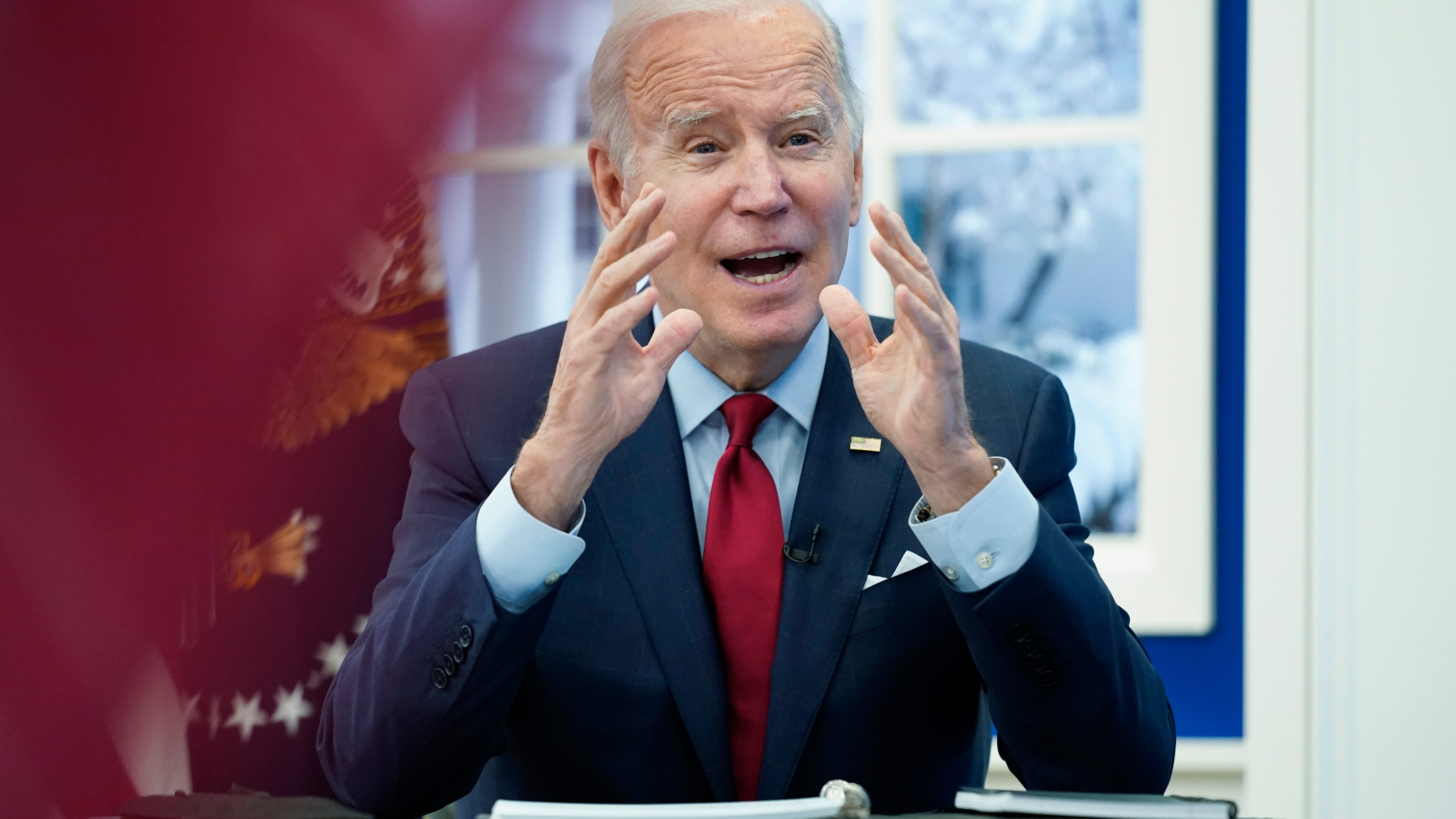 Biden urges concern but not alarm as omicron rises