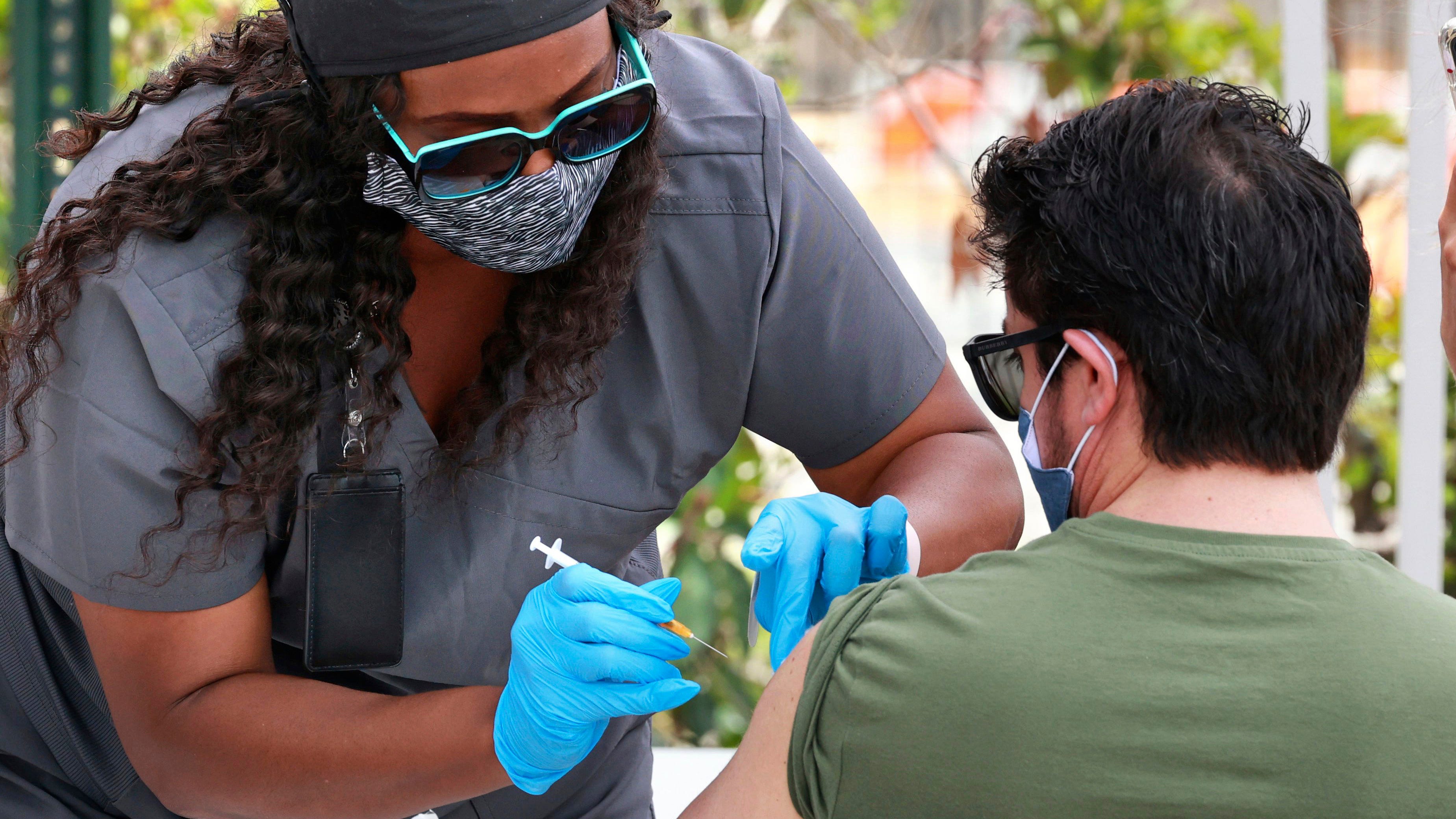 US hitting encouraging milestones on virus deaths and shots