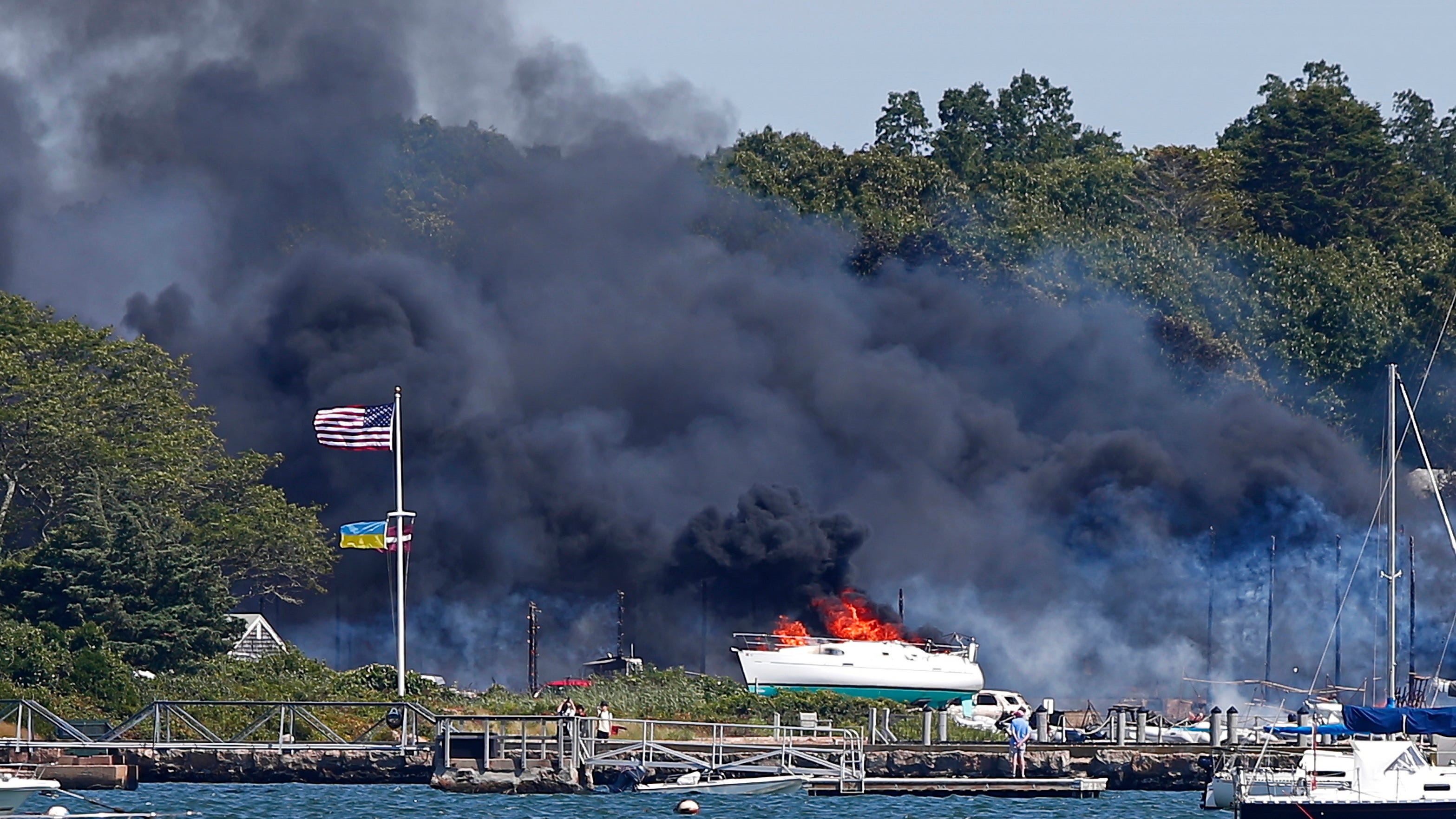 Large fire consumes boats, buildings, vehicles at boatyard