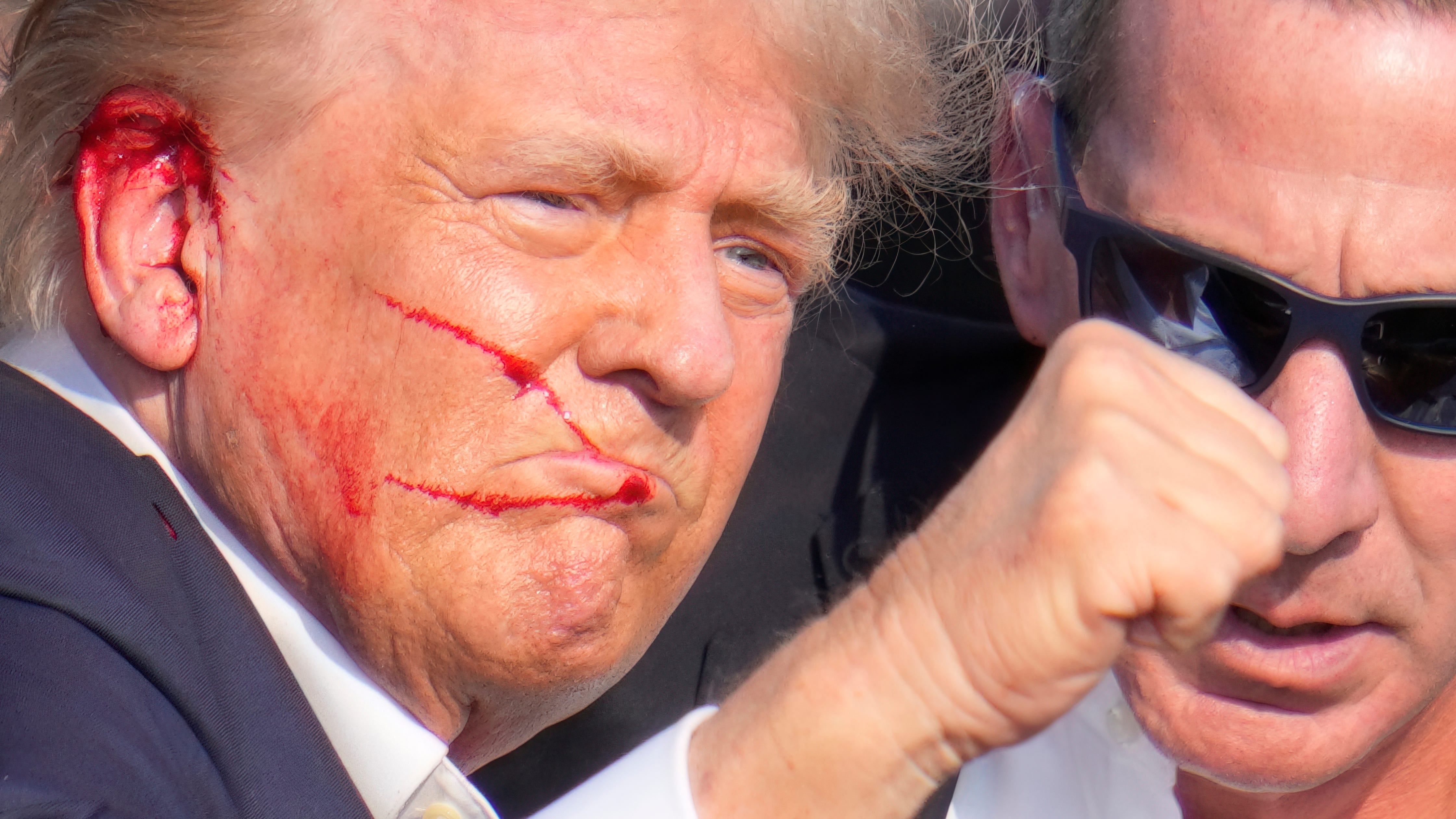 Trump is wounded but 'fine' after apparent assassination attempt; suspect had bomb-making materials