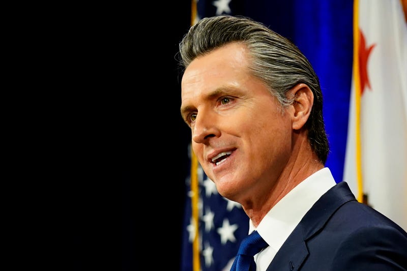 FILE - California Gov. Gavin Newsom delivers his annual State of the State address in Sacramento, Calif., Tuesday, March 8, 2022. On Tuesday, March 22, 2022, Newsom signed a law that will make abortions cheaper for people on private insurance plans. The new law bans private insurers from charging things like co-pays and deductibles for abortion services starting Jan. 1, 2023.