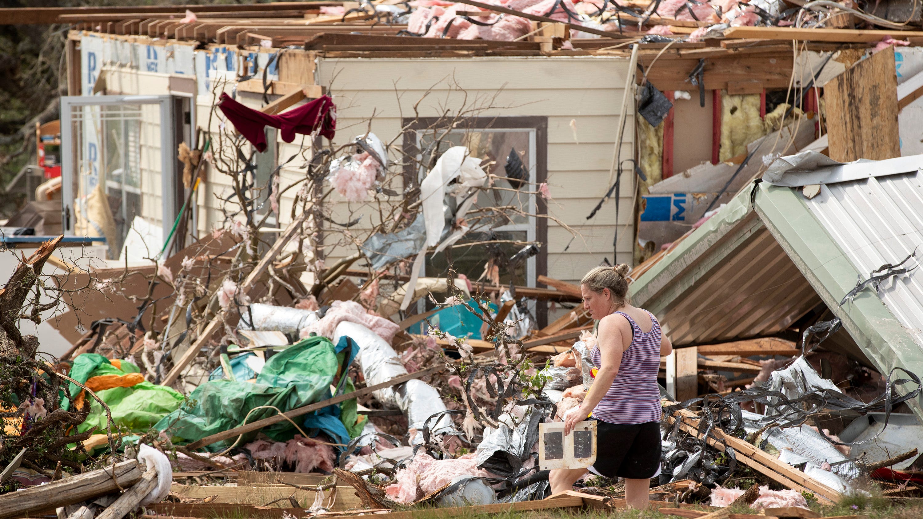 Woman killed by falling tree as storms hit Midwest, South