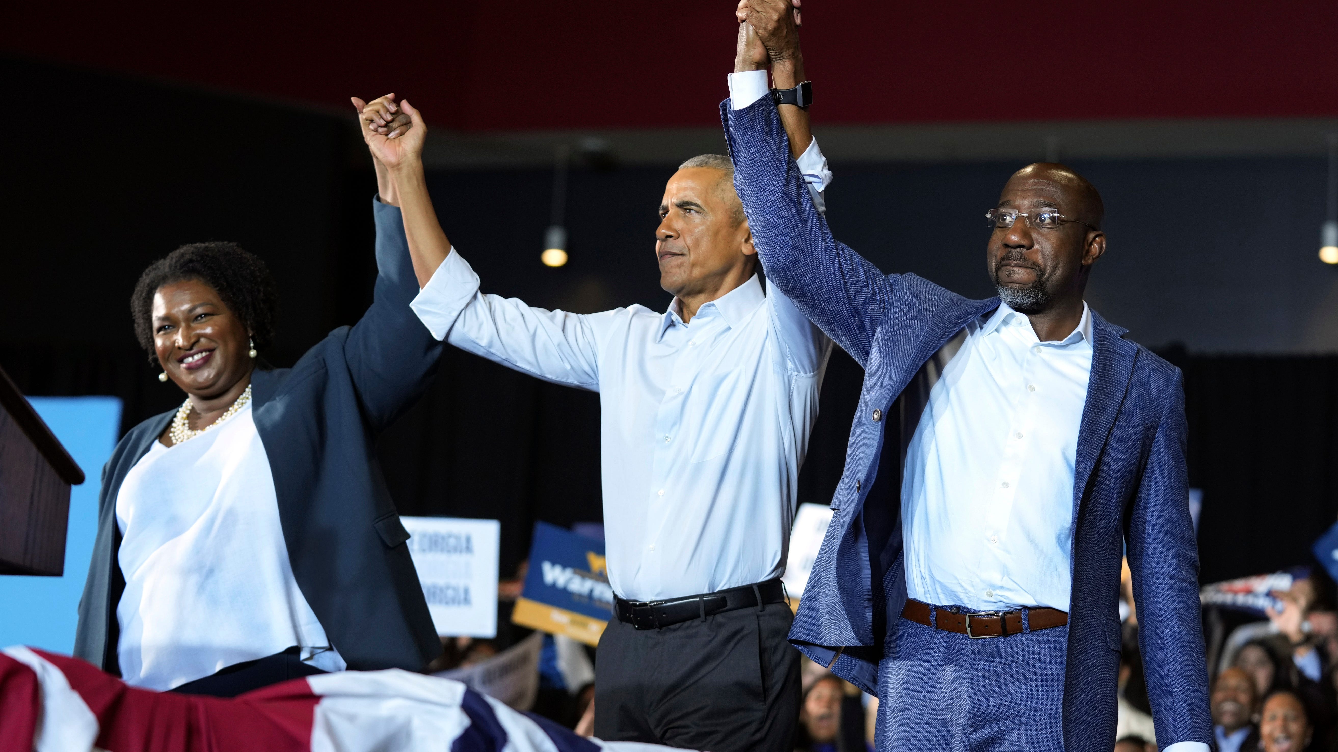 Obama, campaigning in Georgia, warns of threats to democracy