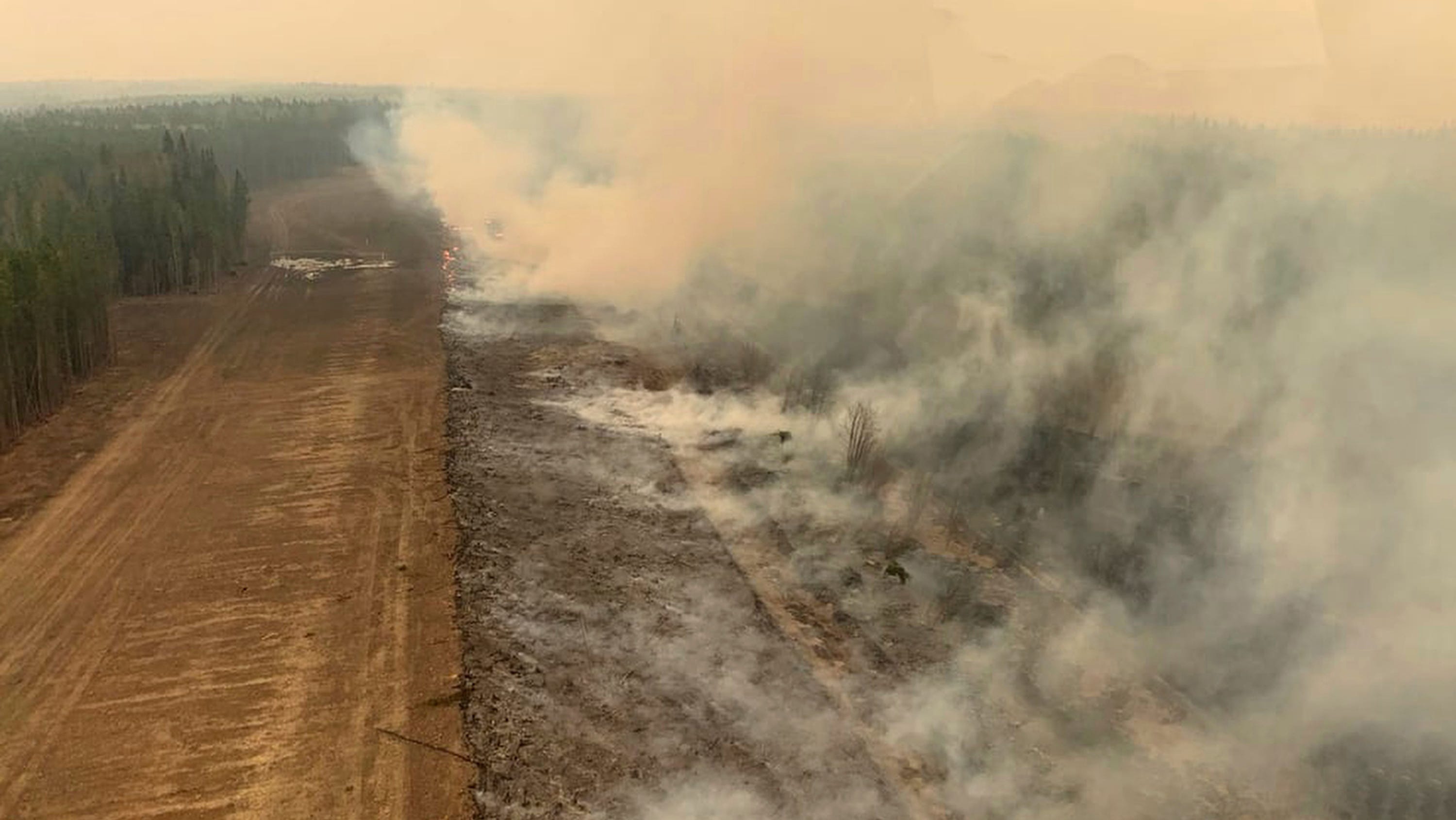 Out-of-control wildfires cause evacuations in western Canada