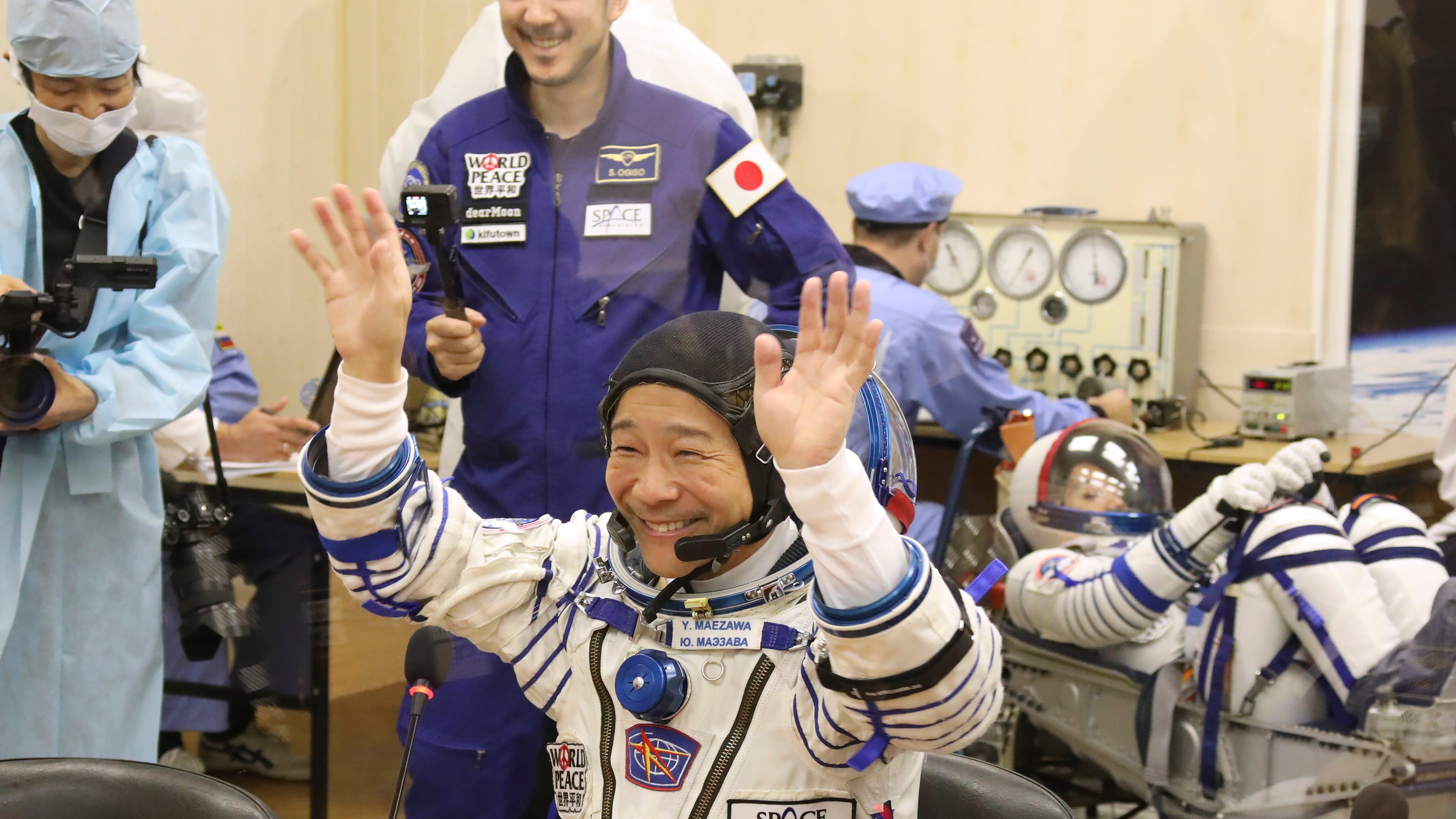 Japanese tourists dock at International Space Station 