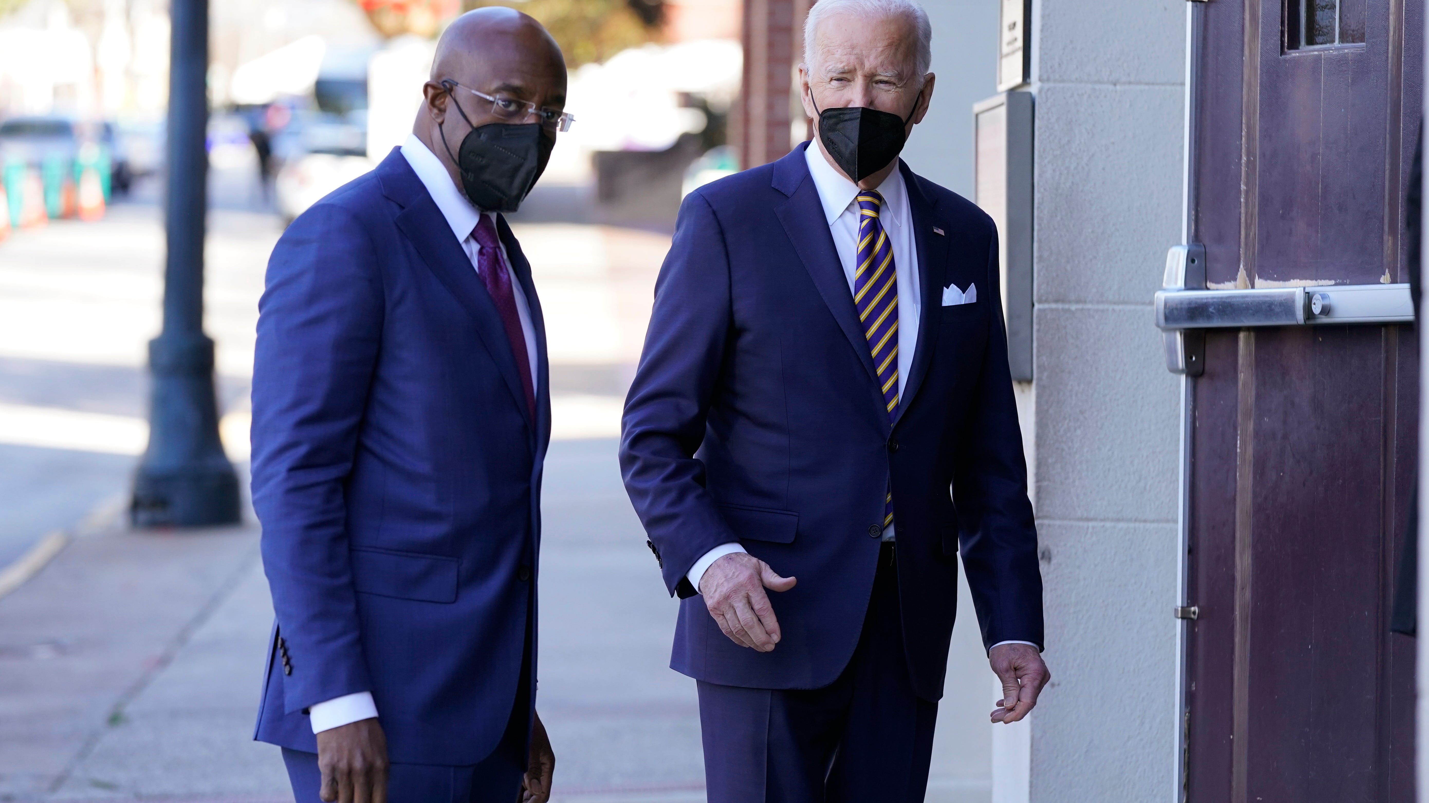 Biden welcomed back to Georgia after lying low in midterms