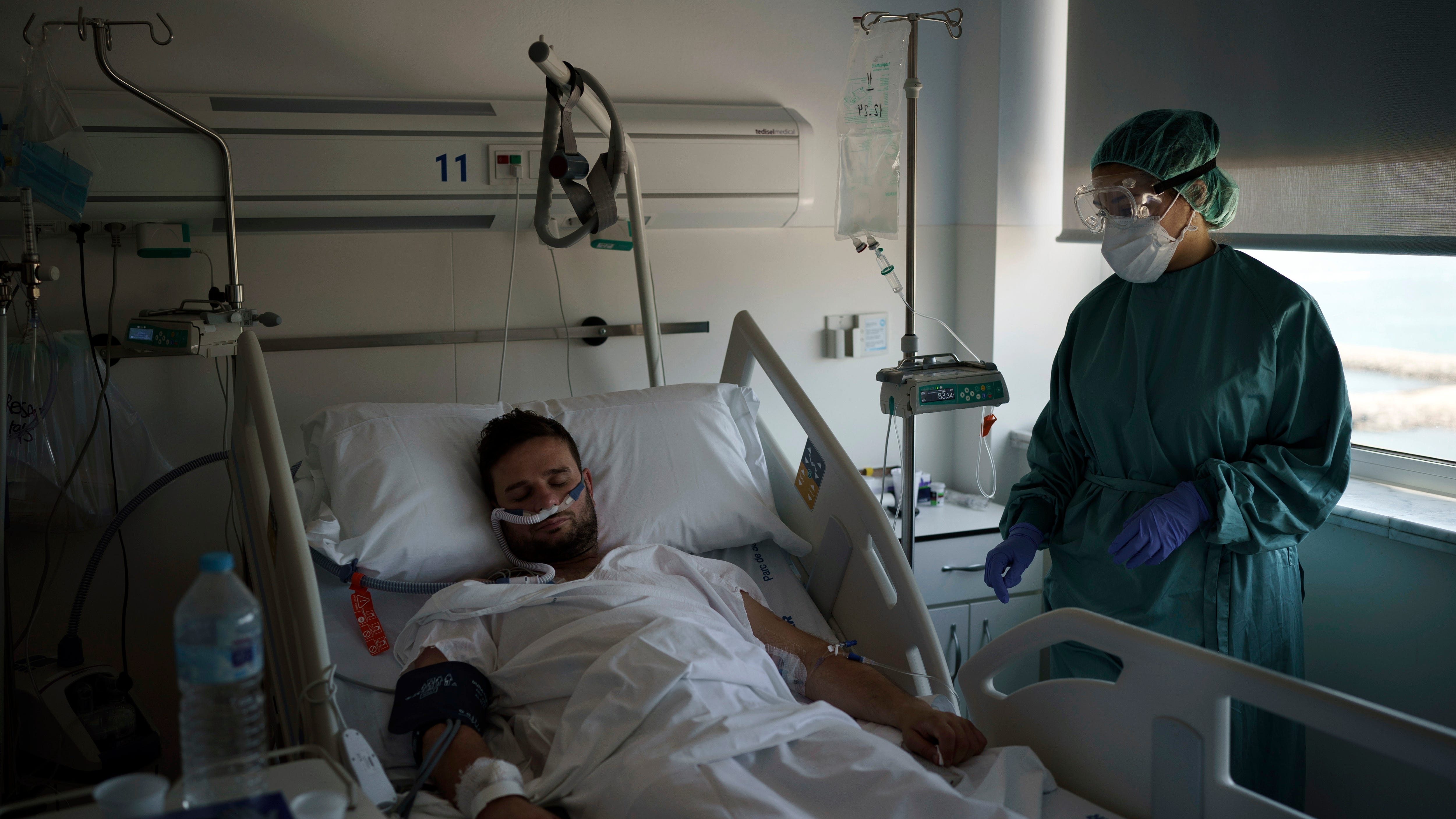 New virus surge sends younger patients to Spain's hospitals