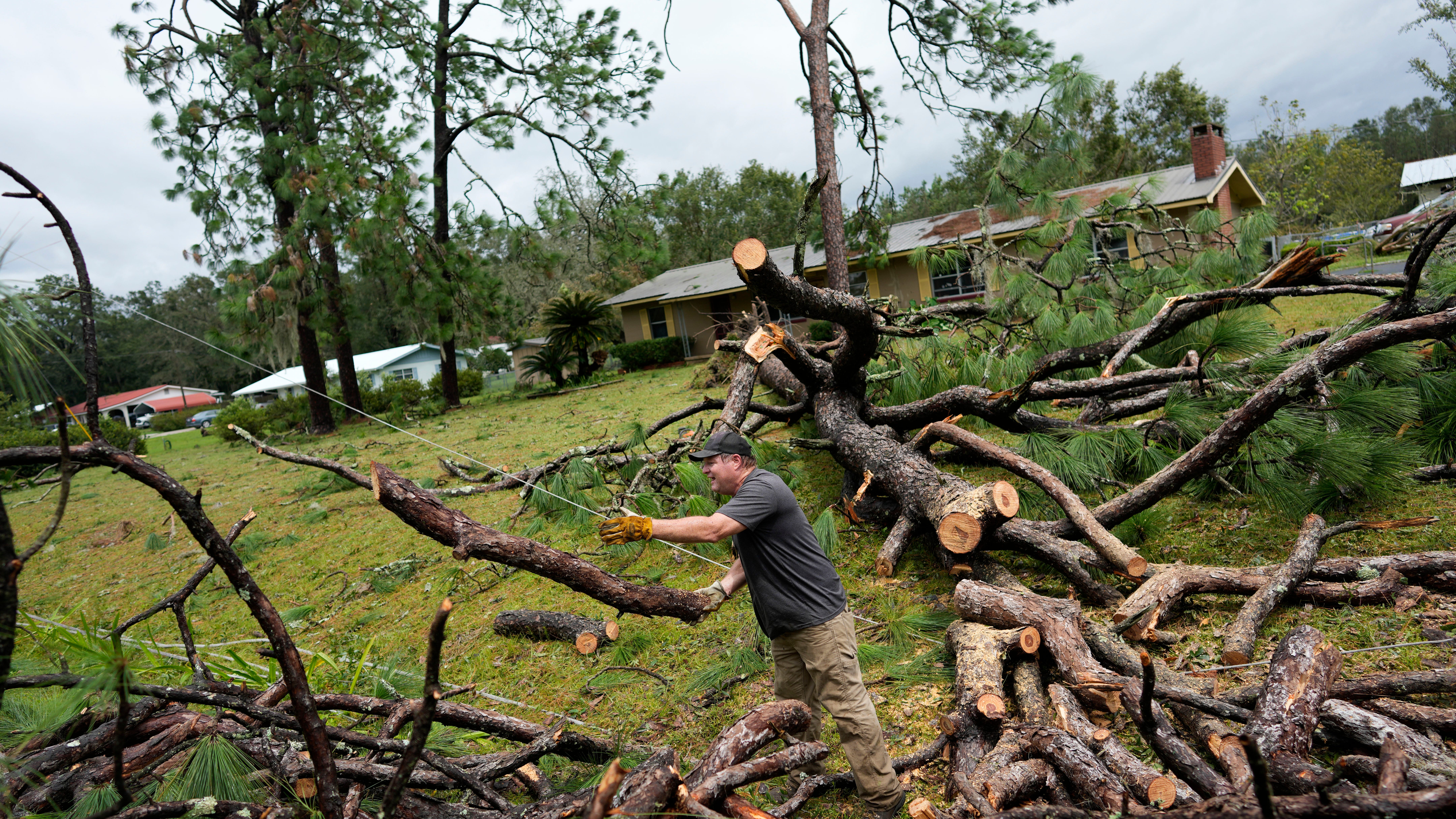 Hurricane Idalia hits Florida with 125 mph winds, flooding streets, snapping trees and cutting power