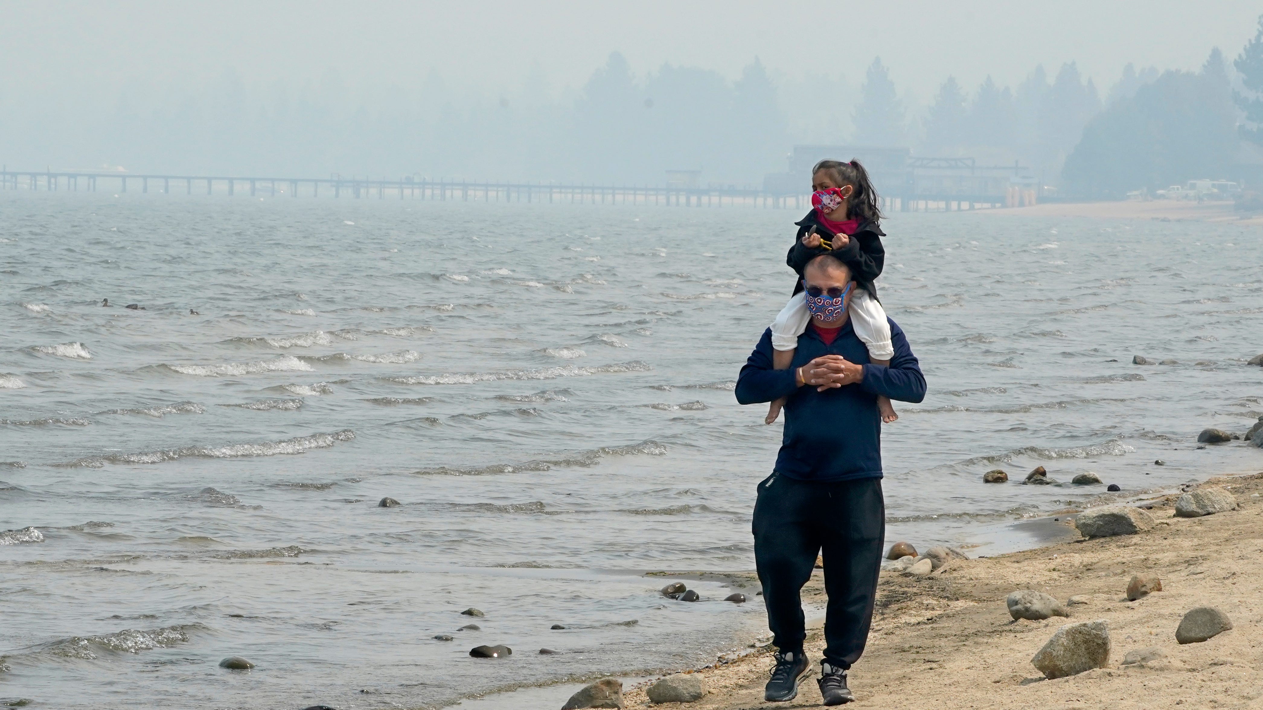 Pristine Lake Tahoe shrouded in smoke from threatening fire