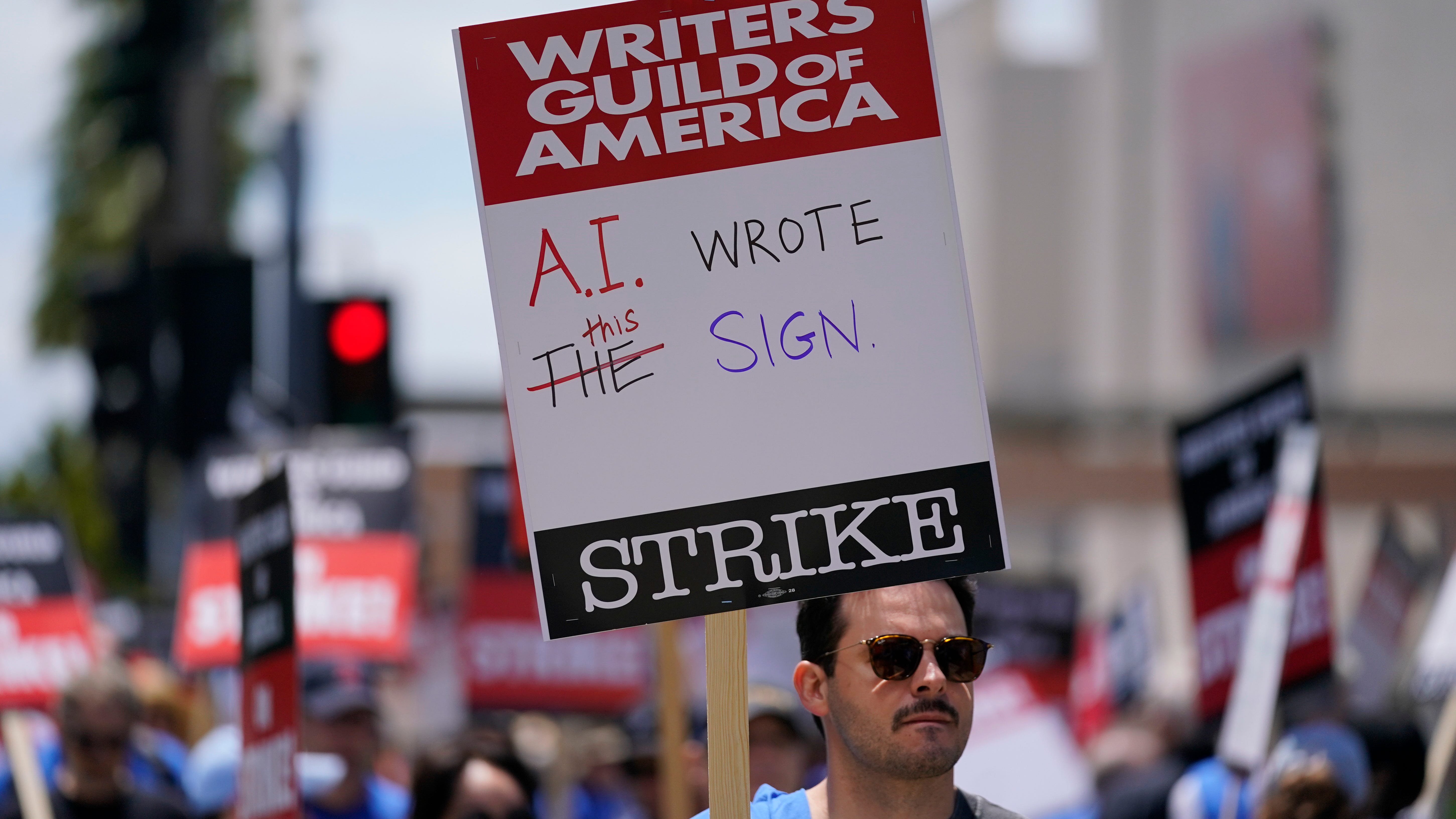 AI is the wild card in Hollywood's strikes. Here's an explanation of its unsettling role