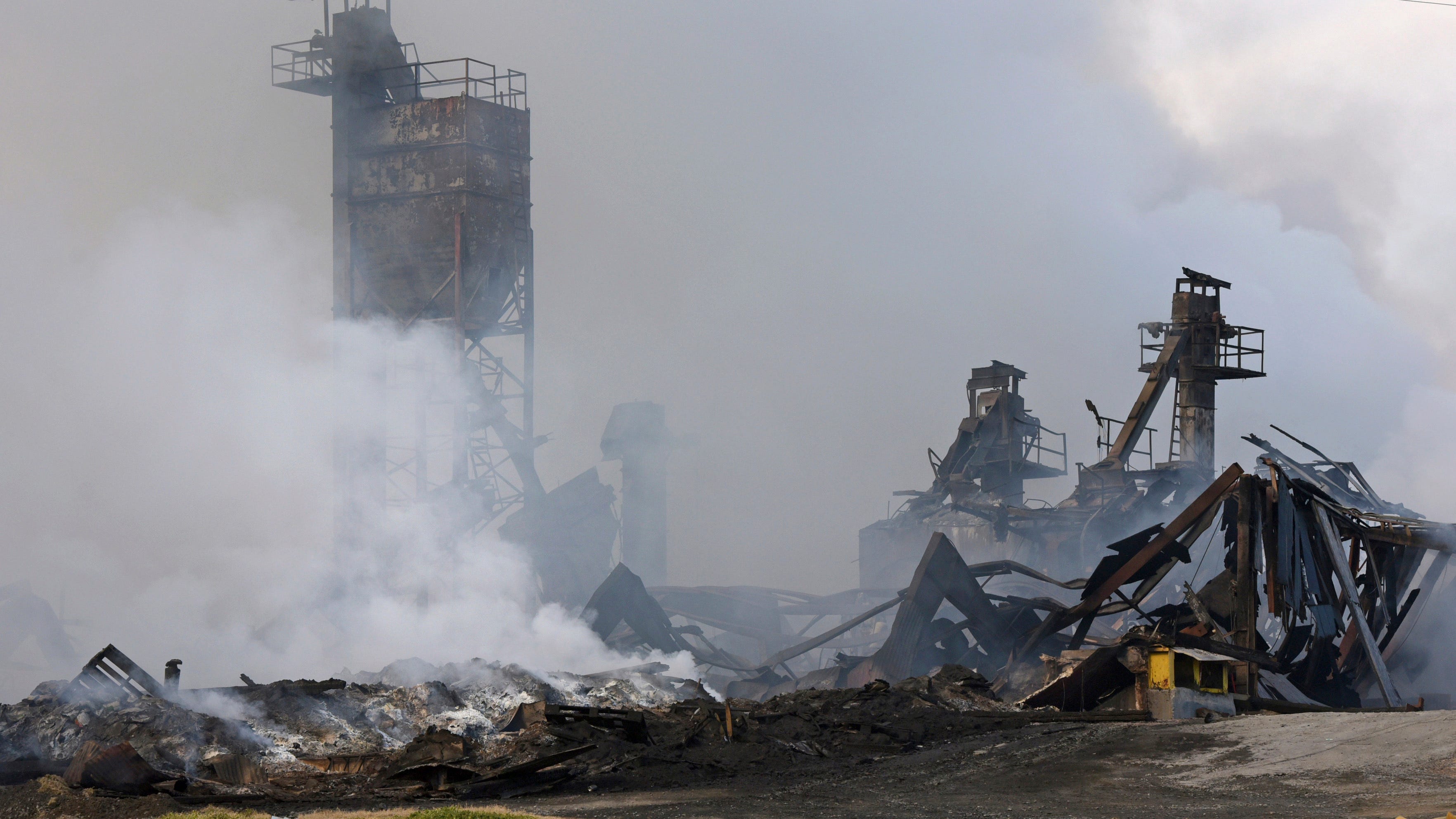 Rain helps suppress plant fire, but explosion risk remains  