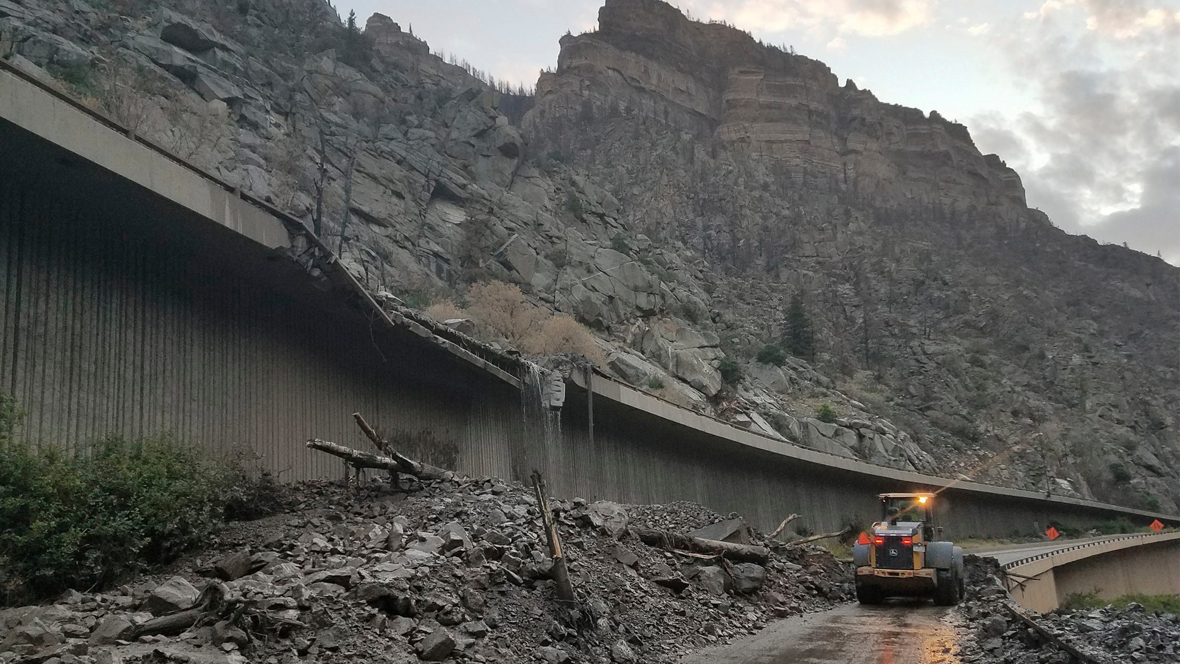 Mudslides force more than 100 to spend night on highway