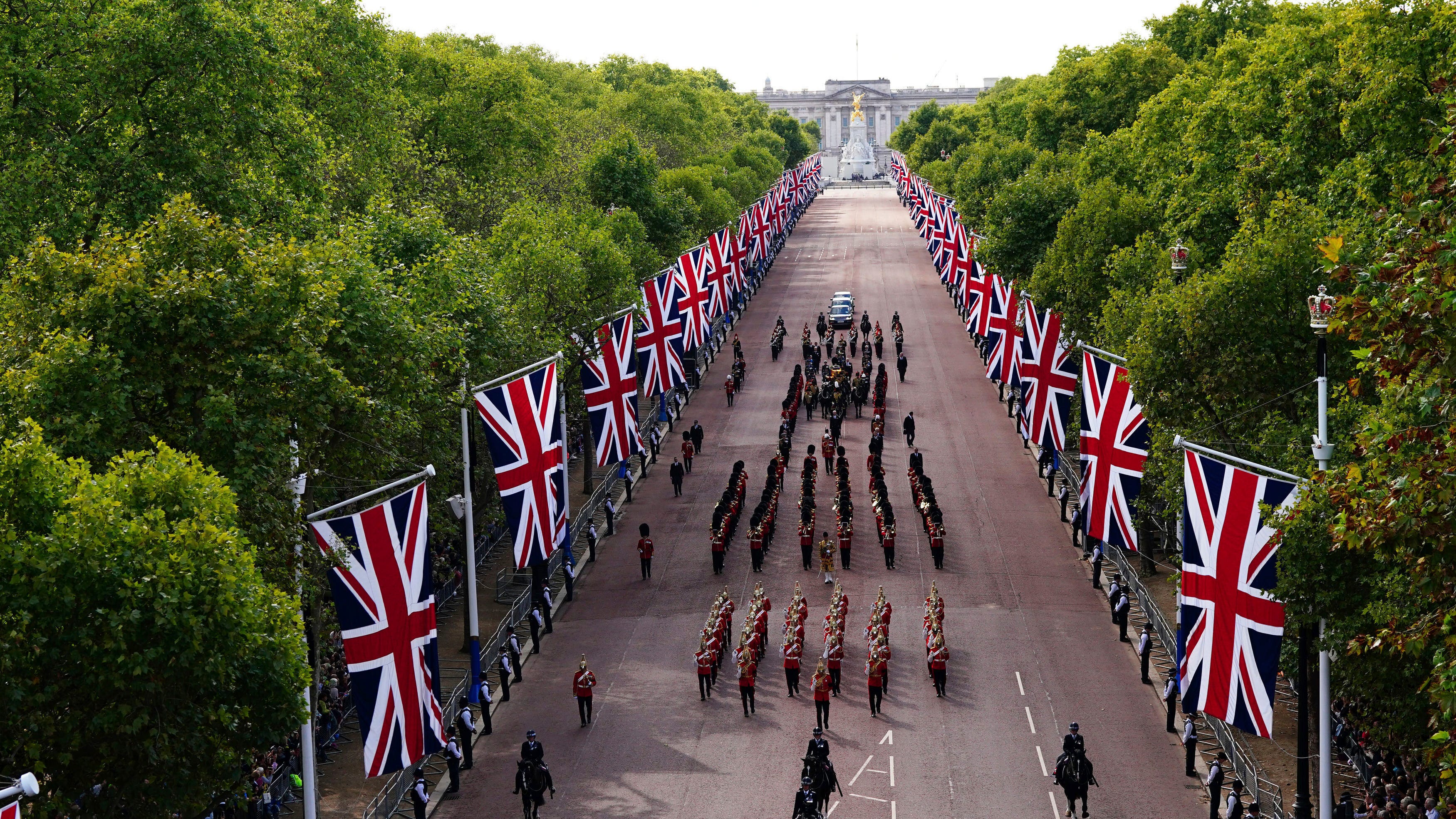 Queen Elizabeth II lies in state after solemn procession
