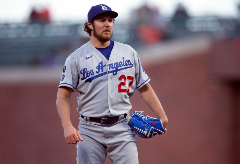FILE - Los Angeles Dodgers starting pitcher Trevor Bauer looks toward home during the fourth inning of the the team's baseball game against the San Francisco Giants on May 21, 2021, in San Francisco. Bauer's administrative leave was extended Friday, March 11, 2022, for a week by Major League Baseball and the players' association.