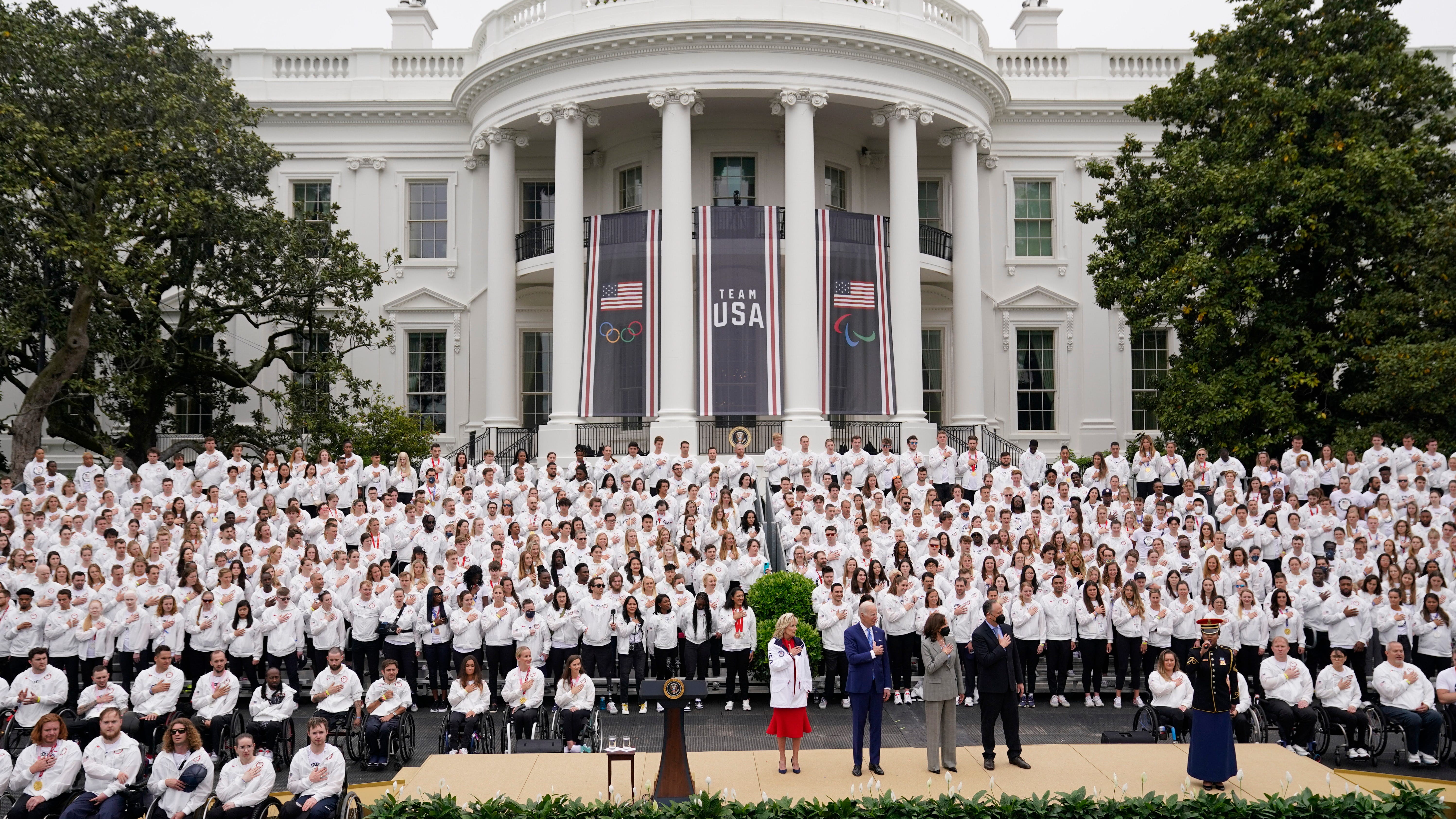Biden says Olympians brought a bit of unity to weary nation