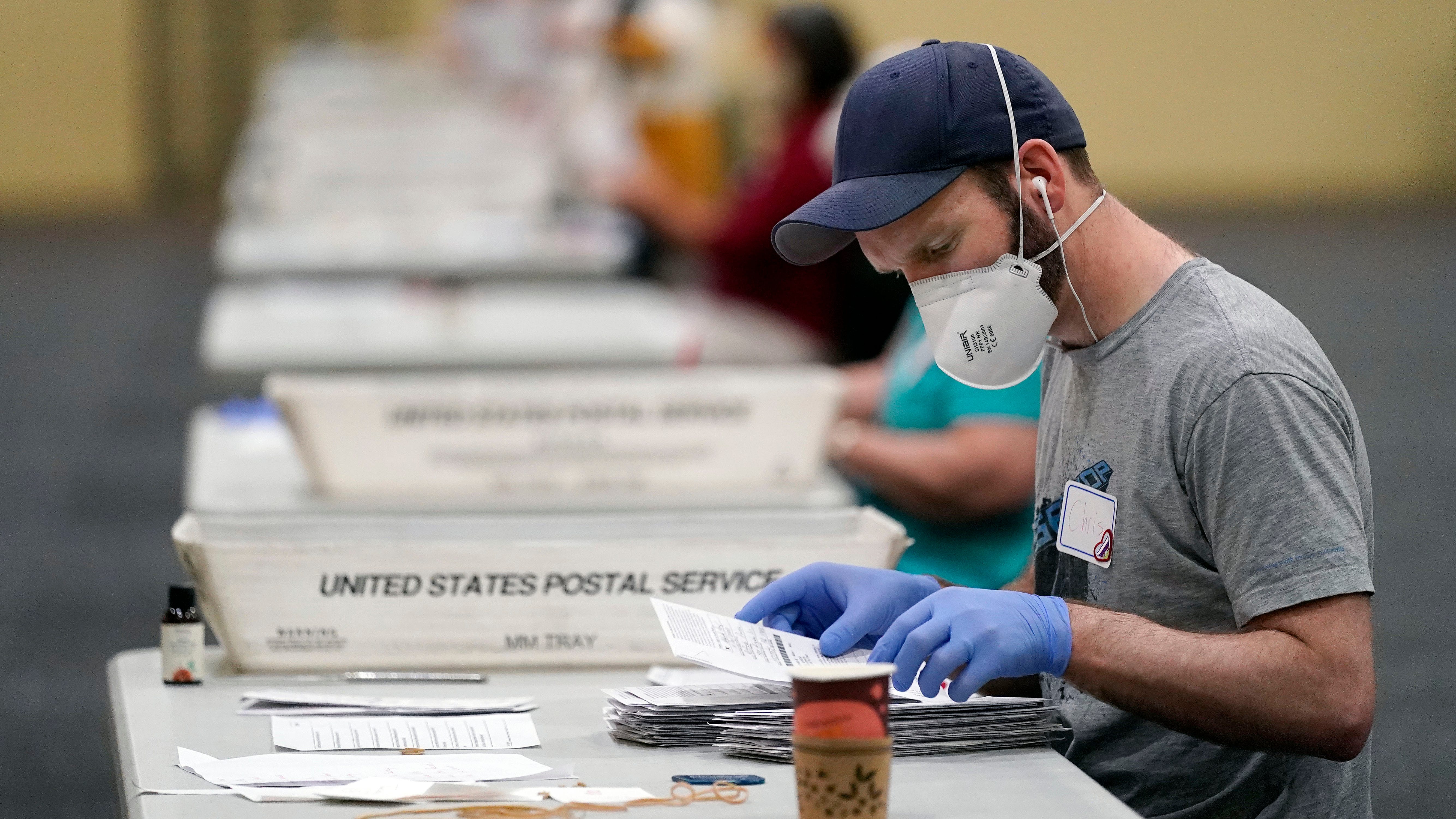 Election officials scramble to count ballots in key states