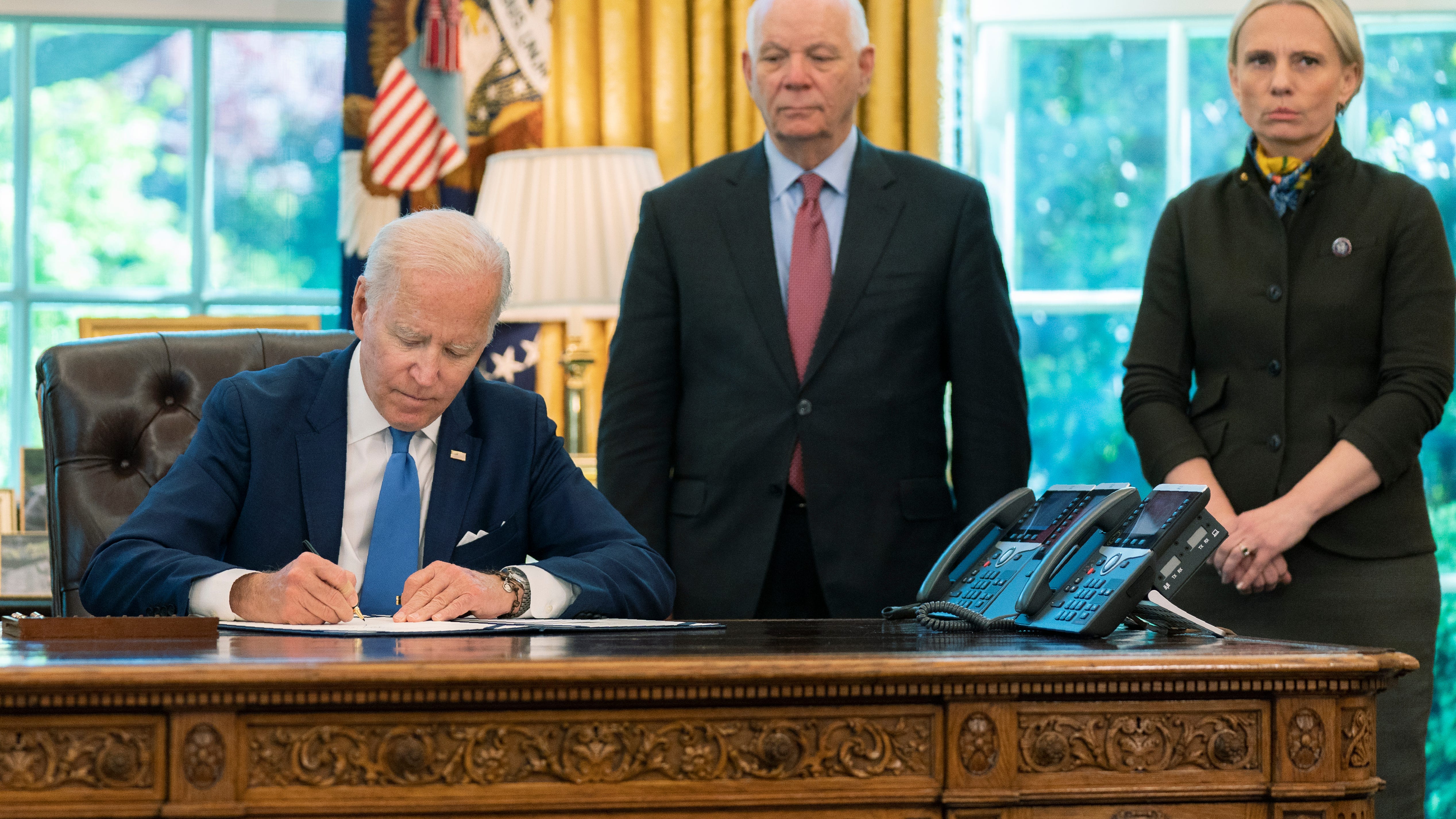 Biden signs Ukraine 'lend-lease' bill in rejoinder to Putin