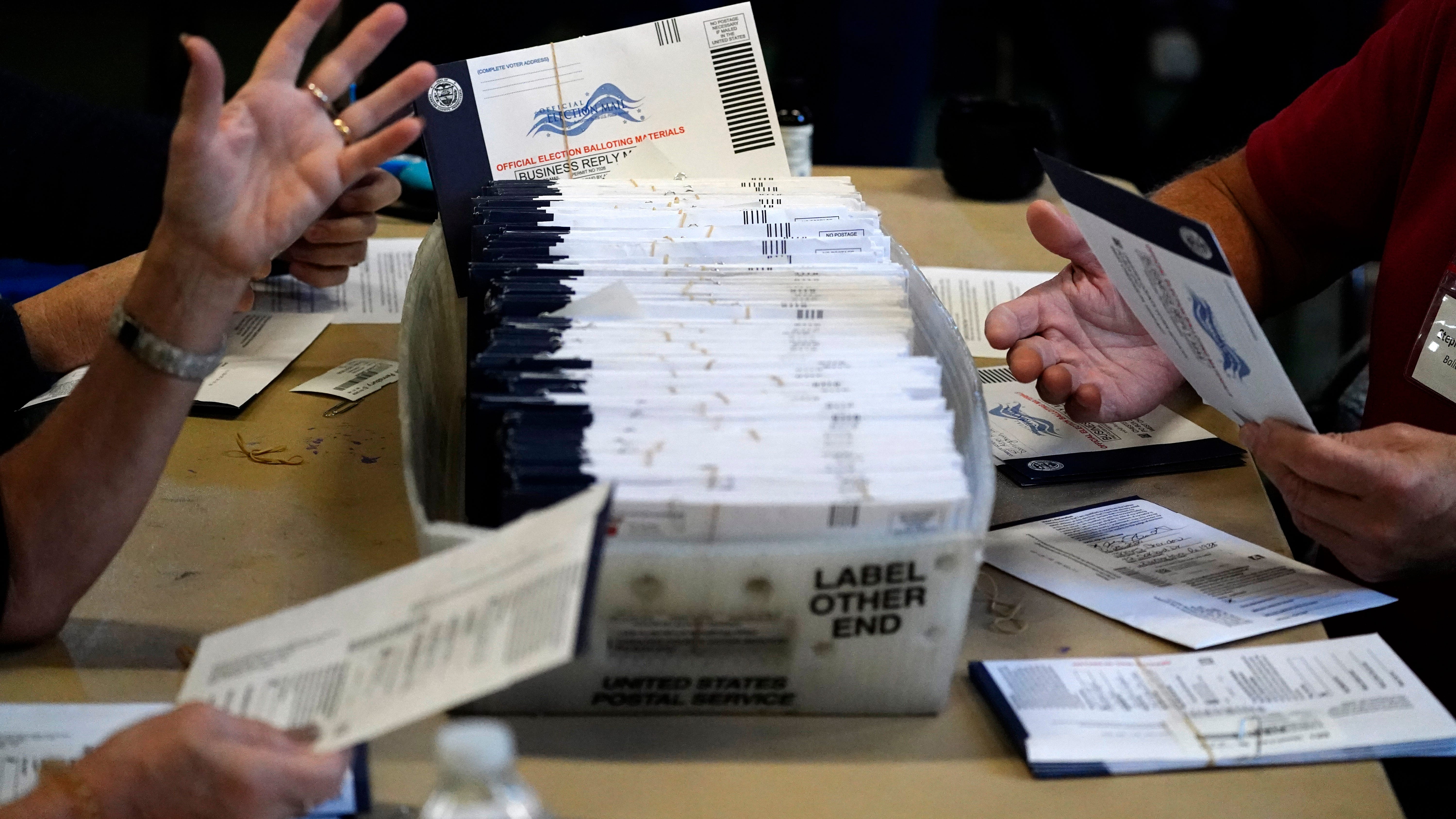 AP VoteCast: Trump, Biden coalitions show race, class divide