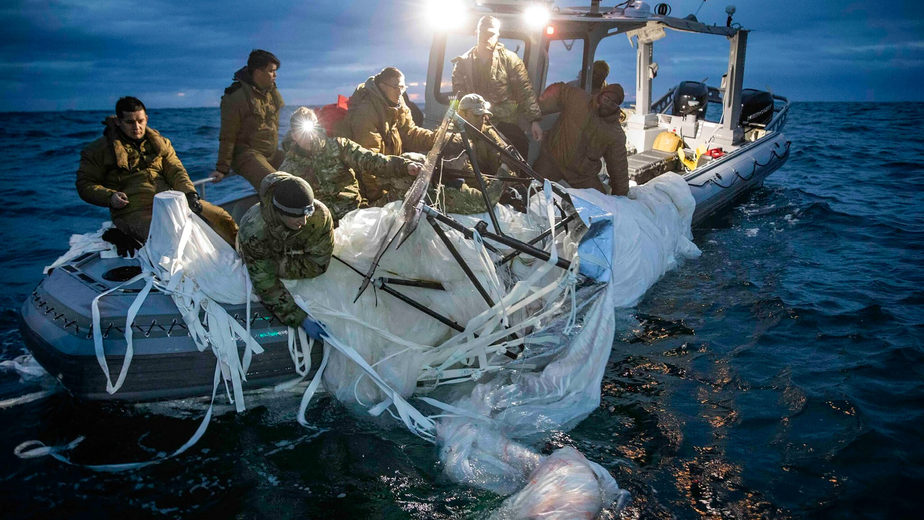 Navy divers begin pulling up Chinese spy balloon debris