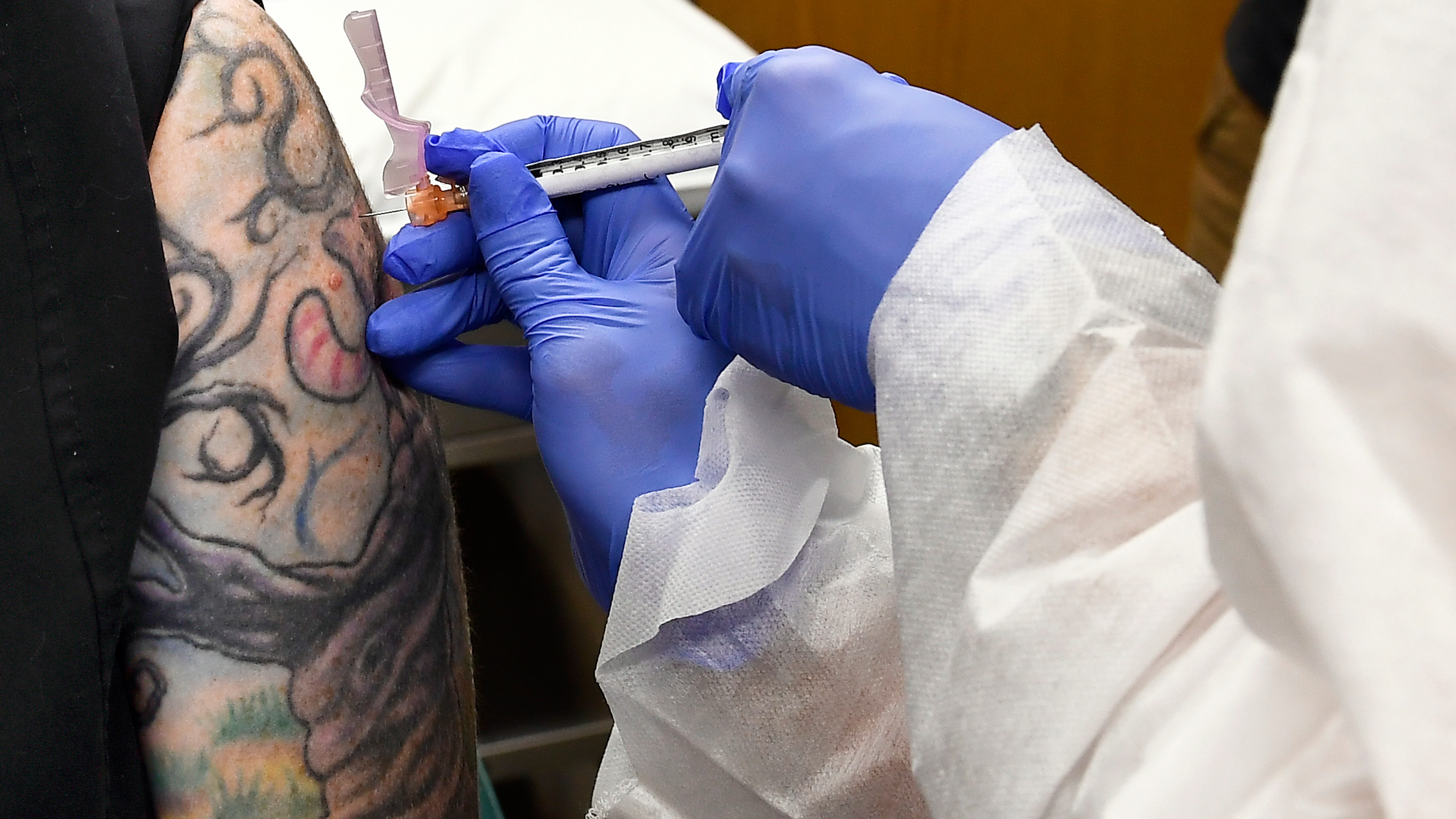 AP-NORC poll: Only half in US want shots as vaccine nears