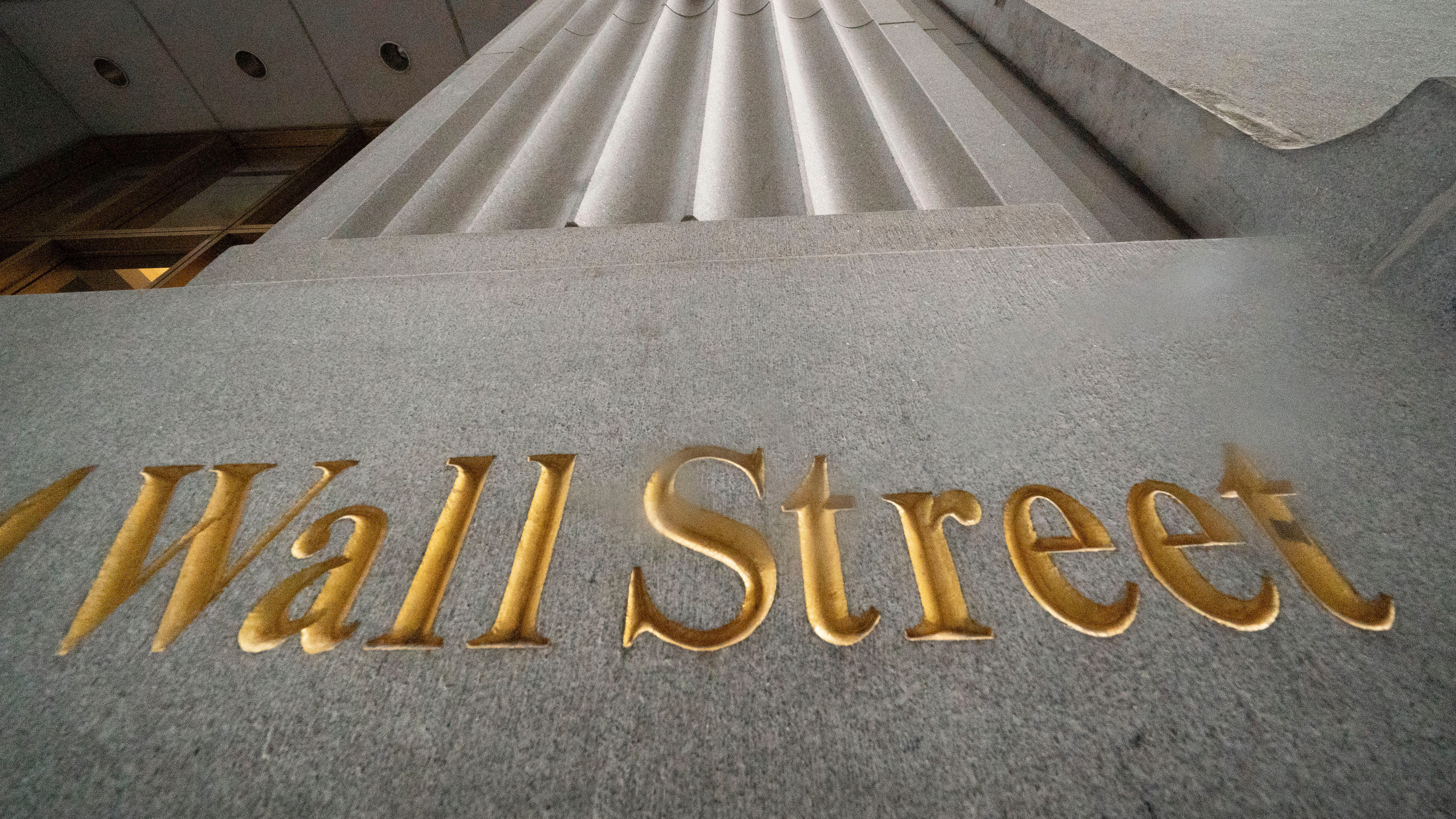 Stocks close higher with help from tech, still down for week