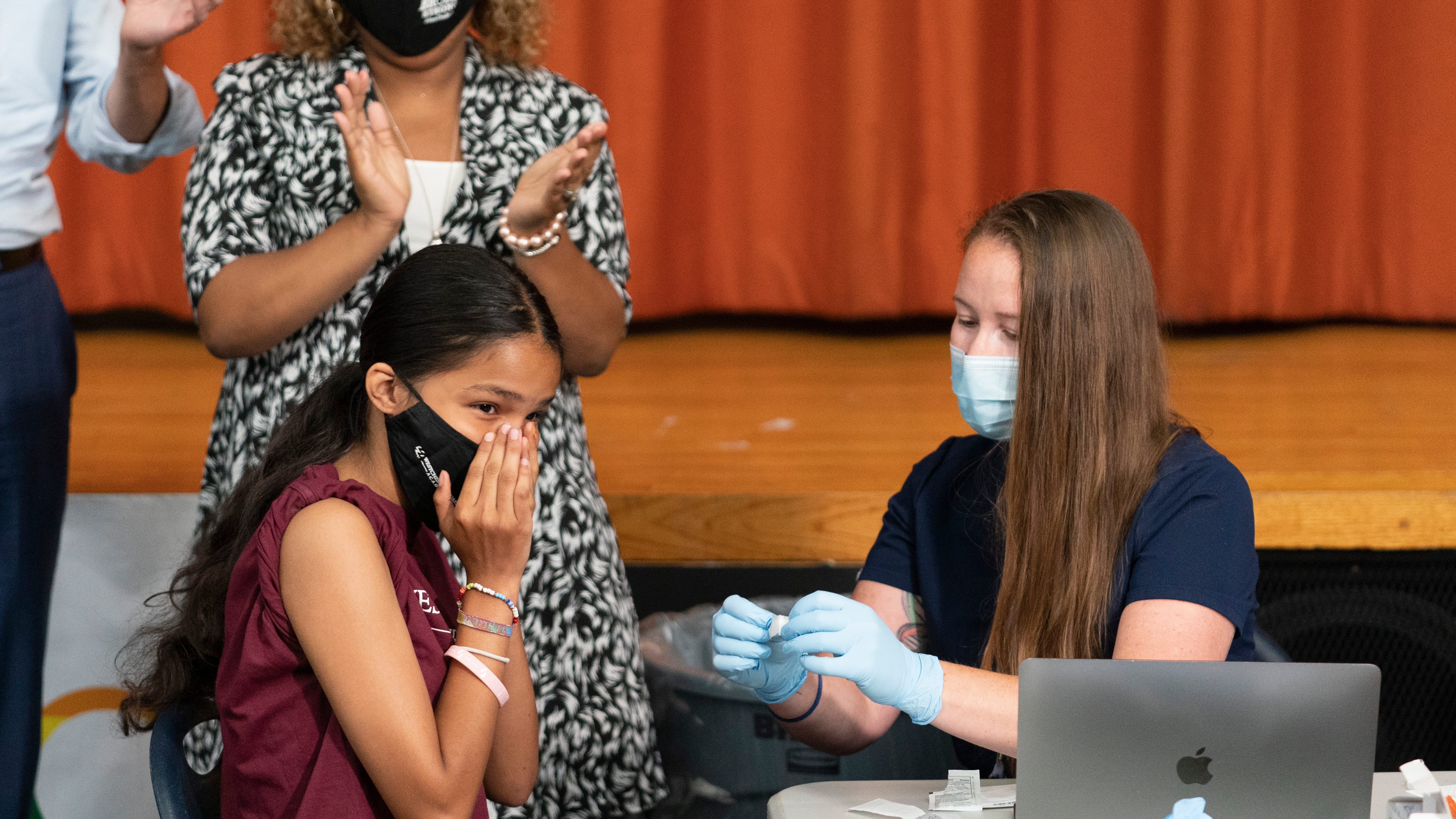 FDA expands Pfizer COVID booster, opens extra dose to age 16