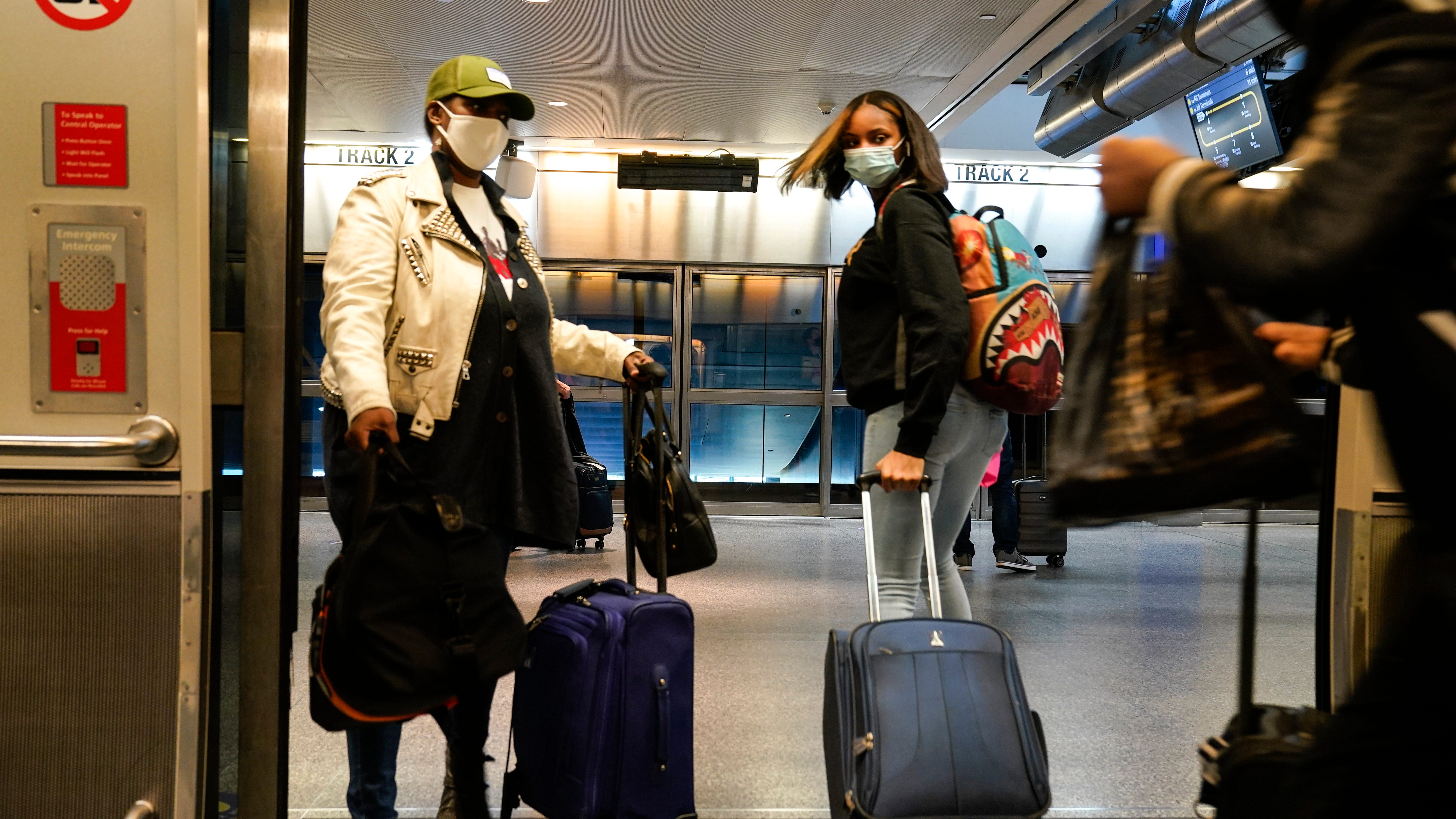 Millions stick to Thanksgiving travel plans despite warnings