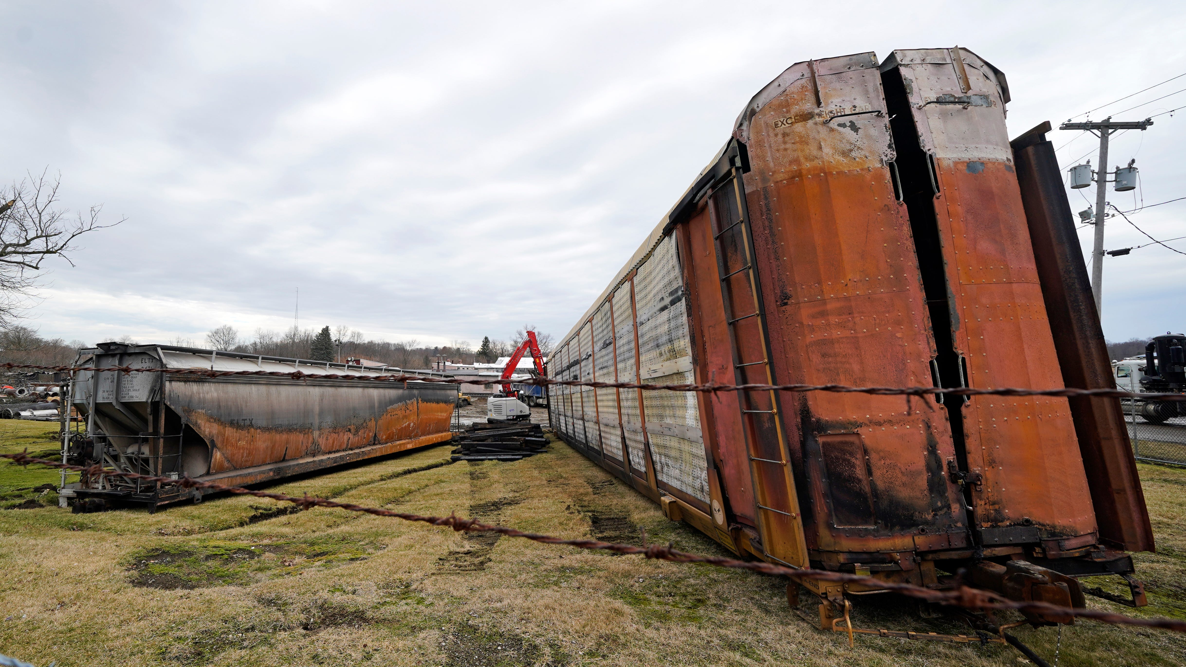 Ohio town takes derailment questions; state considers suing