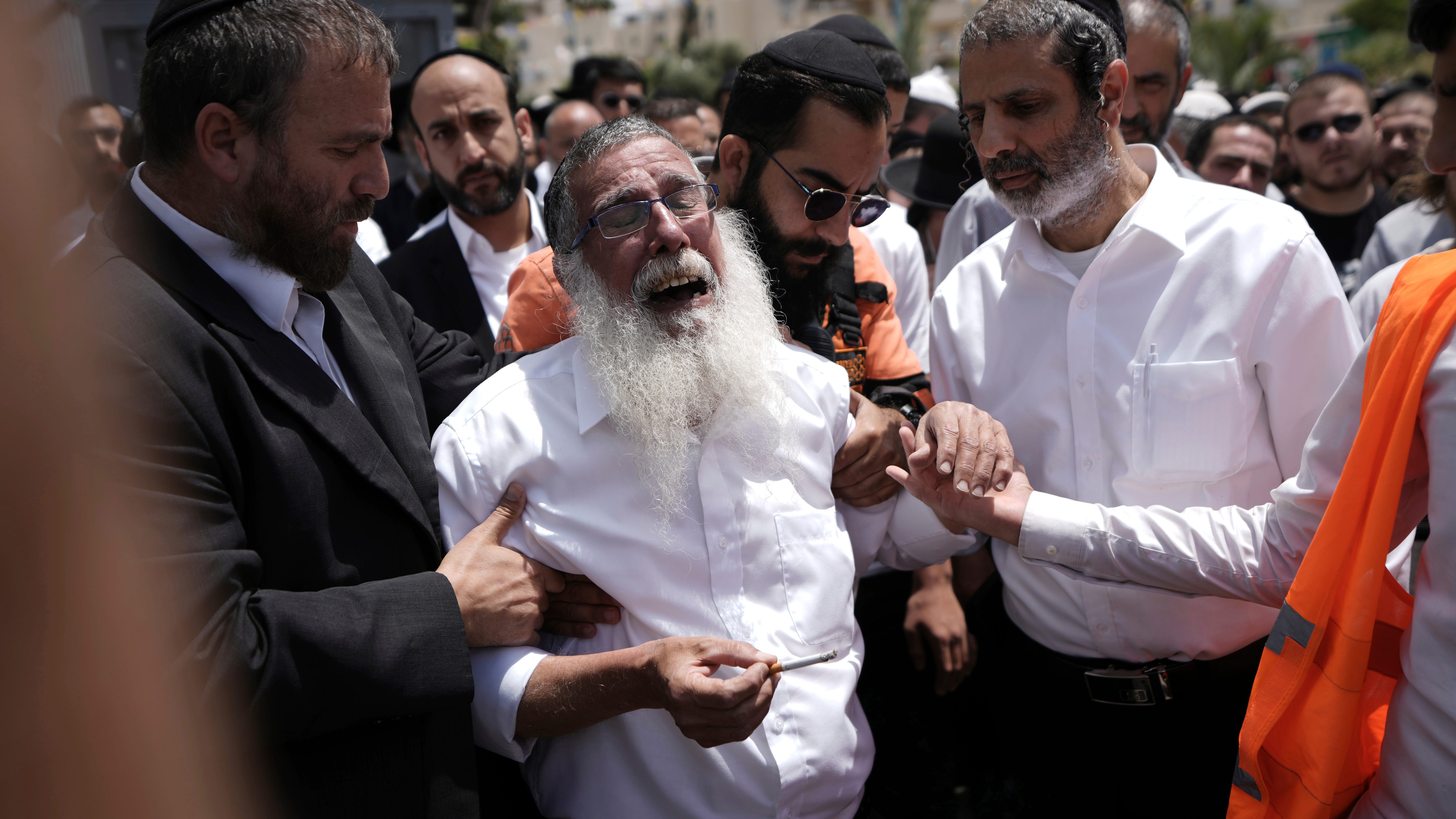 Israel searches for attackers who killed 3 in mass stabbing