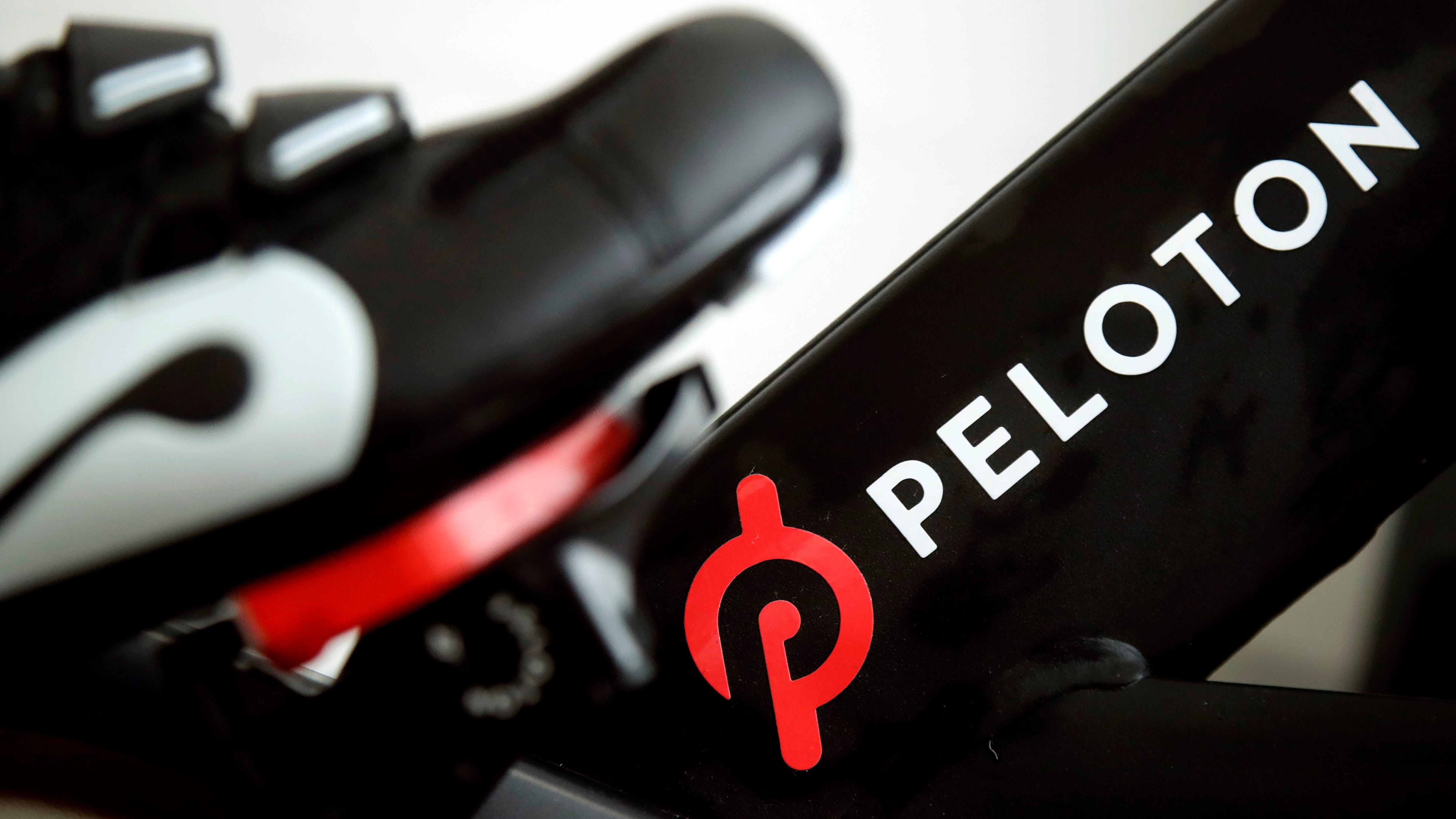 Peloton stock skids as company posts loss, cuts bike price 