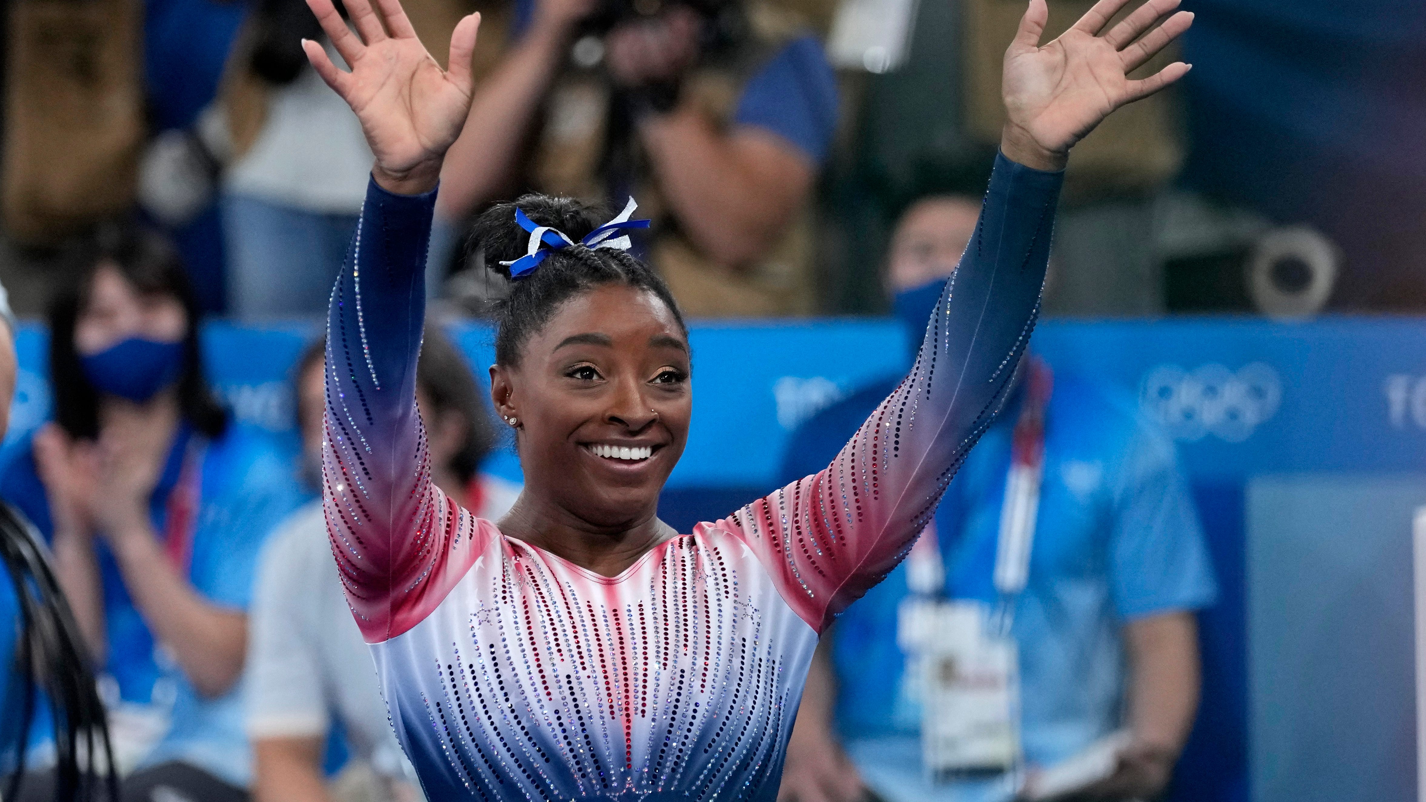 Biles returns to competition with a bronze medal and a smile