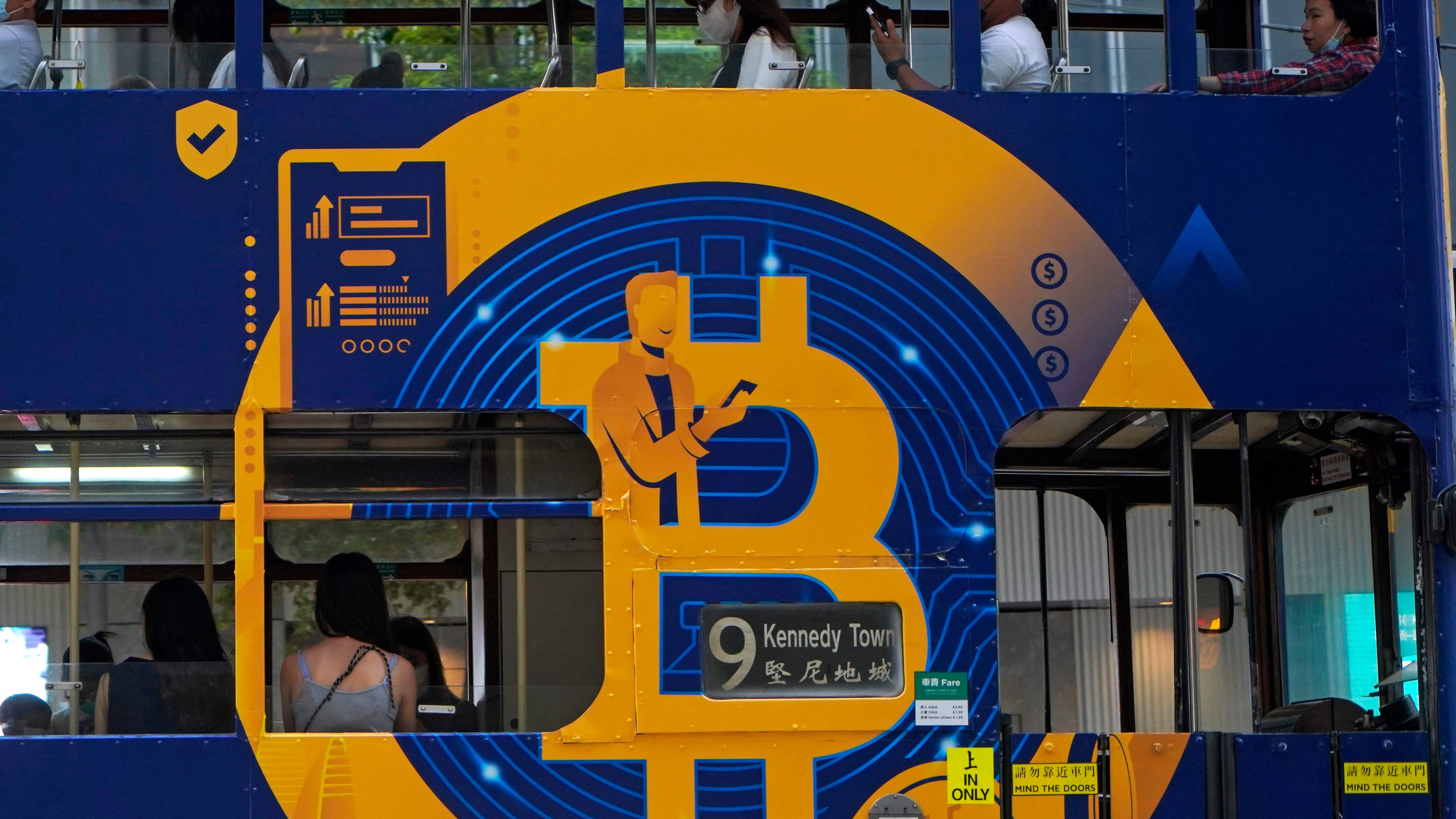 Bitcoin tops $66,000, sets record as crypto goes mainstream