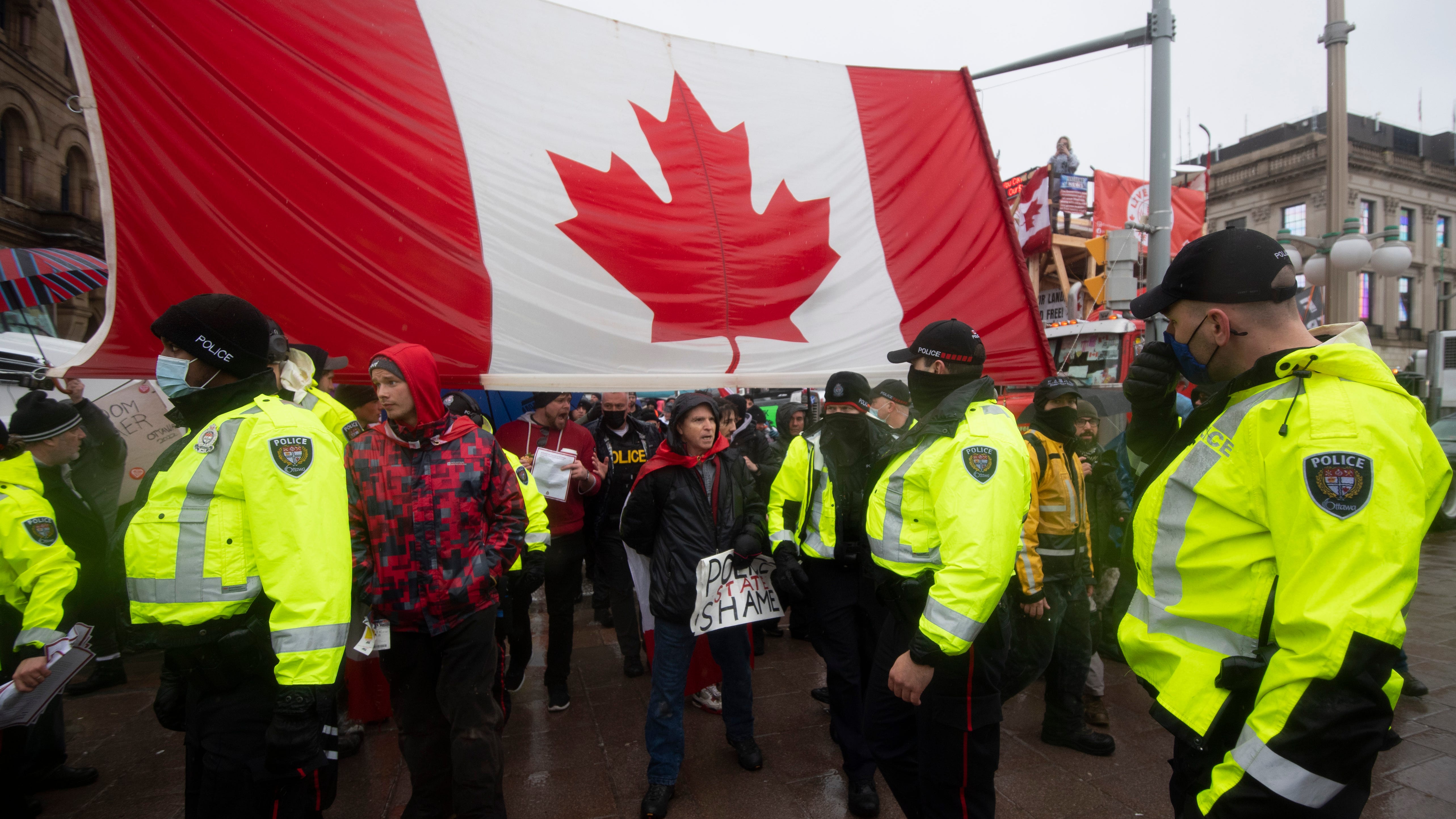 Truckers hold their ground despite threats of crackdown