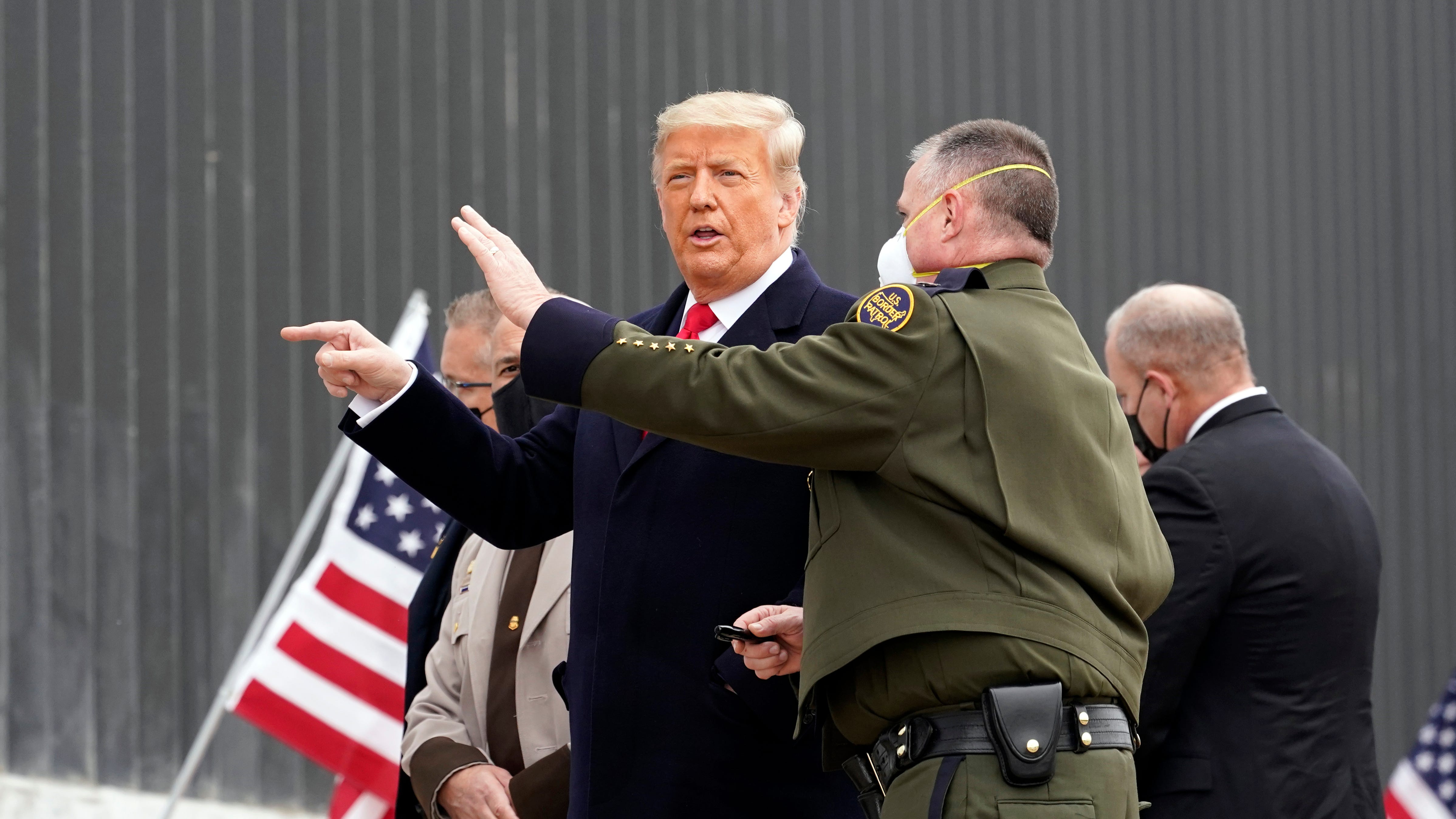 Trump takes no responsibility for riot, visits Texas