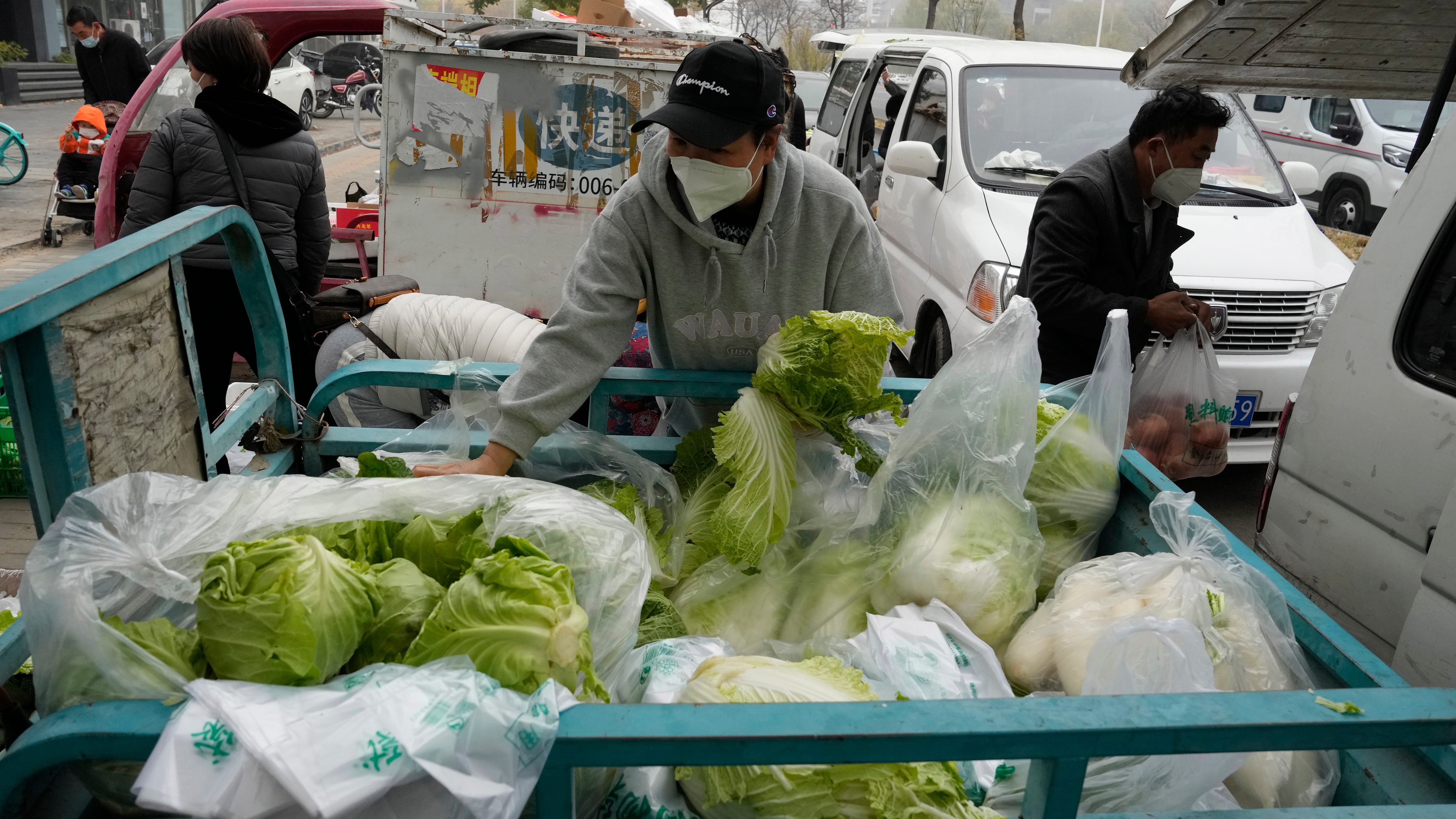 China expands lockdowns as COVID-19 cases hit daily record