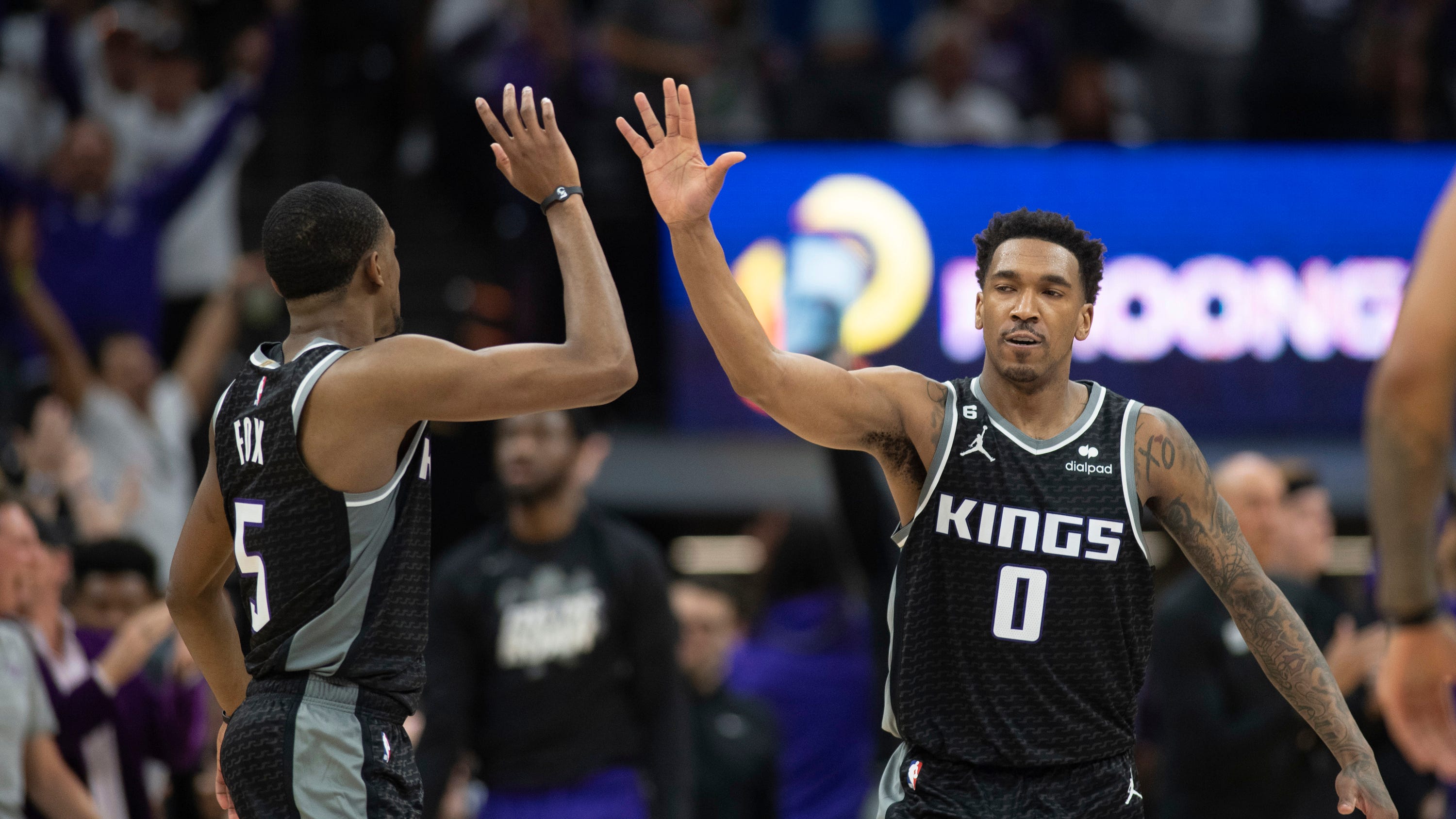 Fox leads Kings past Warriors 126-123 in playoff return