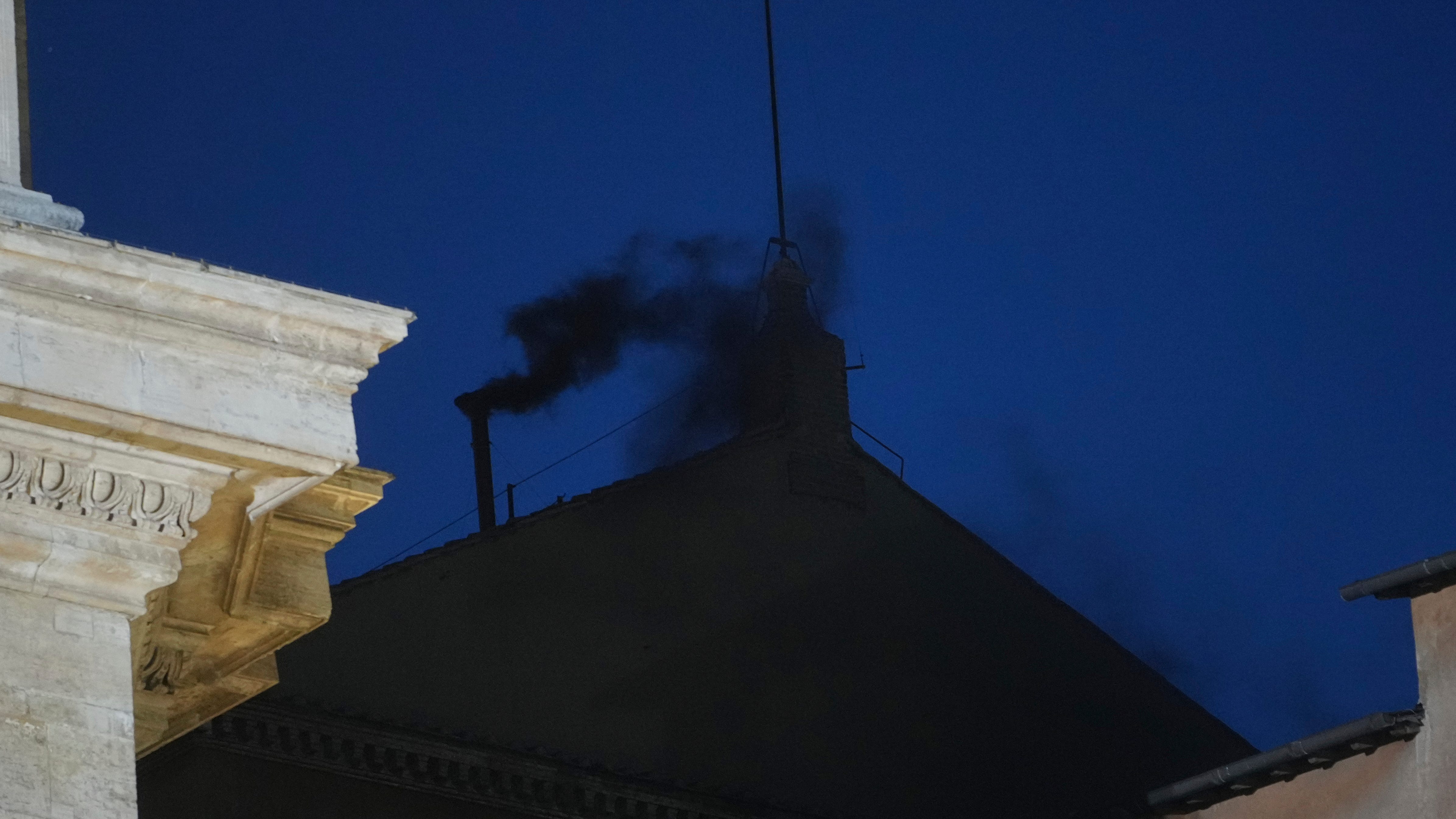 Black smoke pours from Sistine Chapel chimney, indicating no pope was elected as conclave opens
